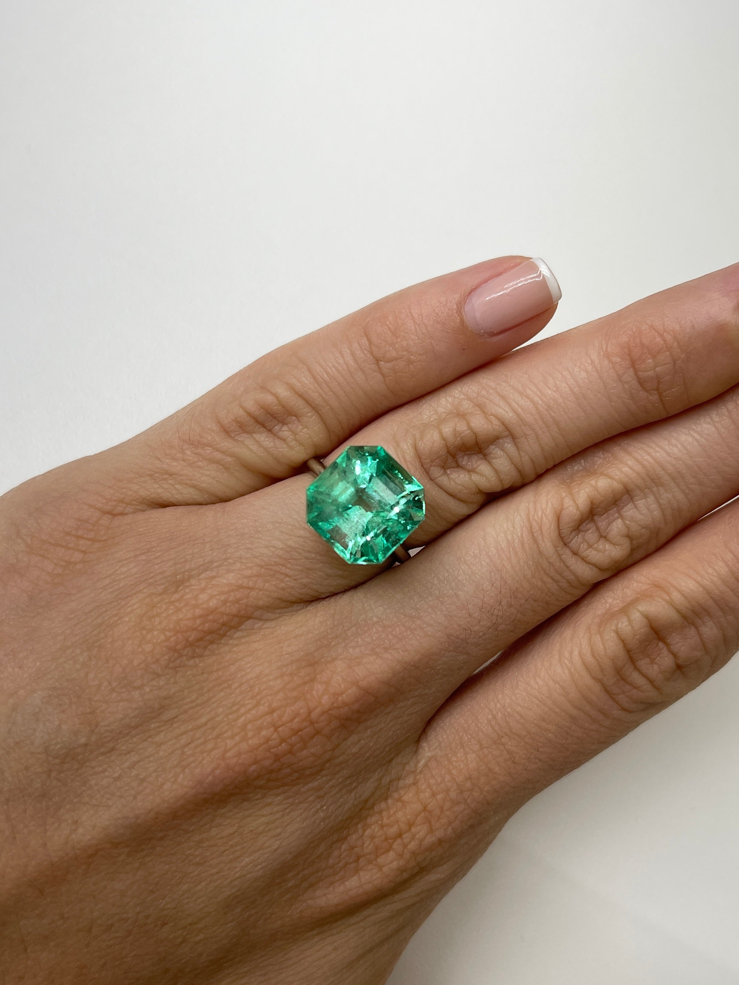 Large 10.49 carat Colombian emerald in 13x13mm Asscher cut, vibrant and natural with deep green color, from JR Colombian Emeralds.