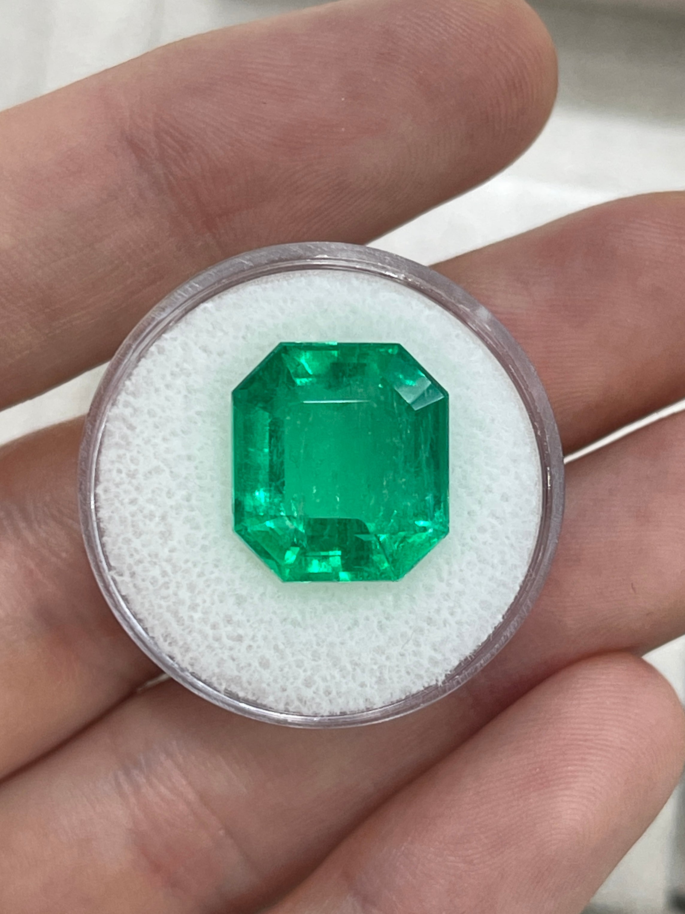Large 10.97 carat Muzo Colombian emerald in emerald cut, deep jungle green, natural loose gemstone from JR Colombian Emeralds