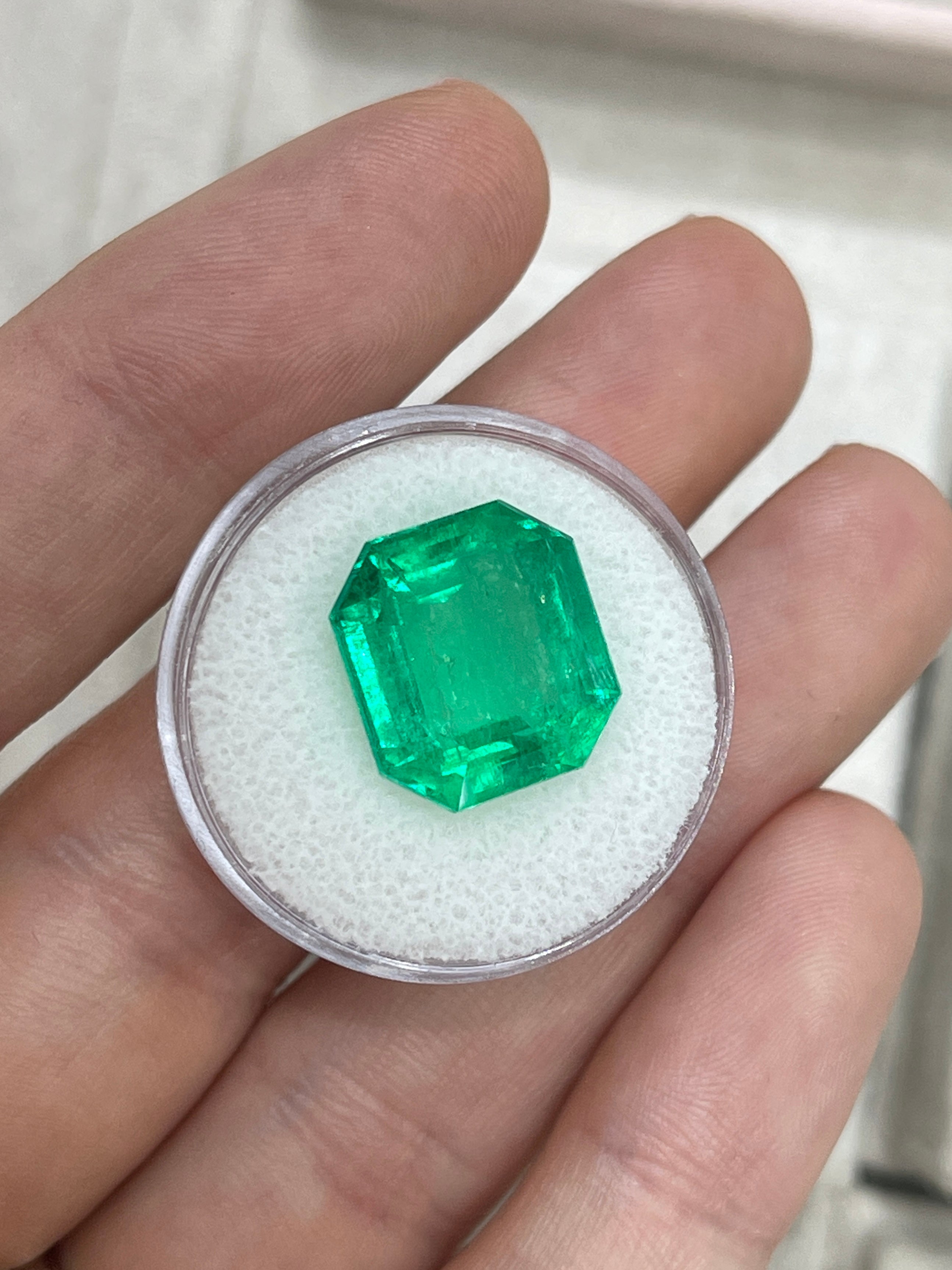 Large 10.97-carat Muzo Colombian emerald in an emerald cut, deep jungle green, natural loose gemstone from JR Colombian Emeralds.