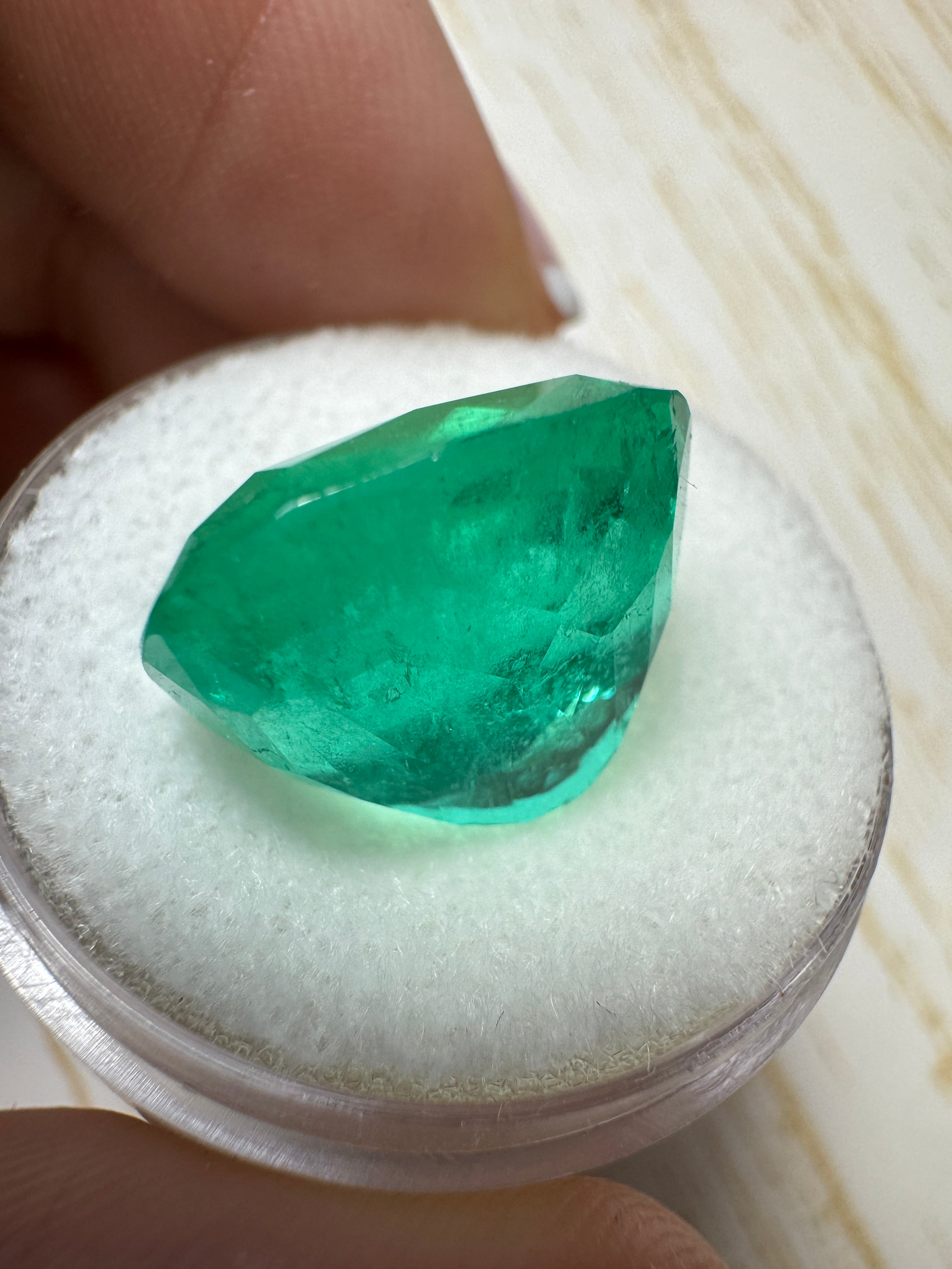 Large 12.50 carat green Colombian emerald loose cushion cut gemstone from JR Colombian Emeralds, natural and stunning.
