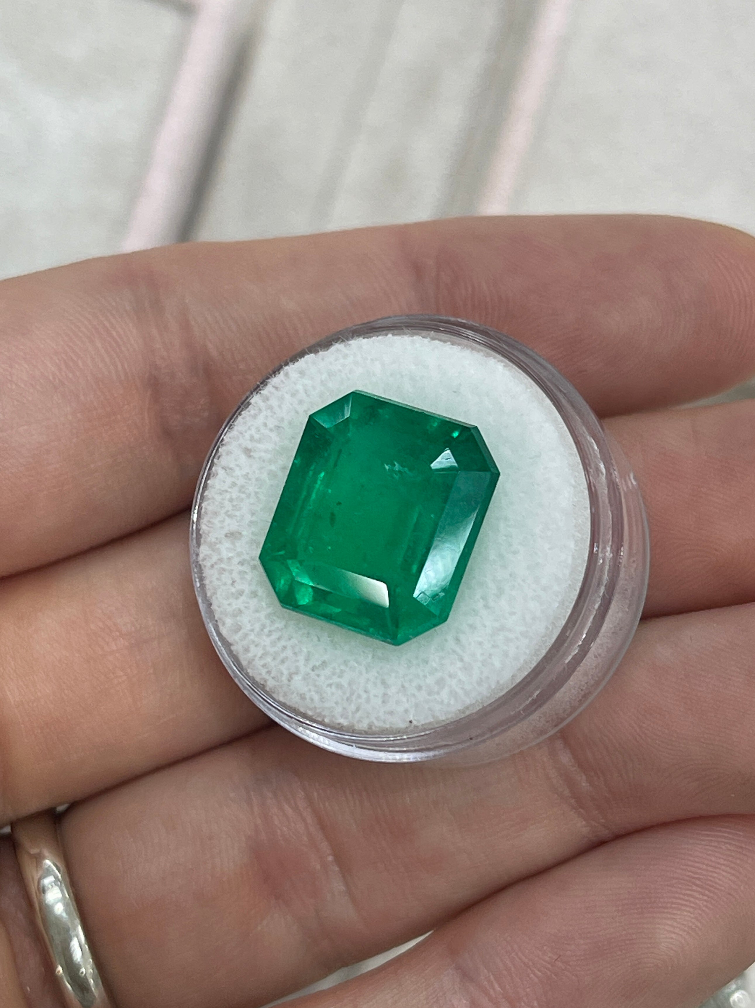 Large 13.04 carat Colombian Emerald in a 15x14mm emerald cut, AAA+ quality, from JR Colombian Emeralds.