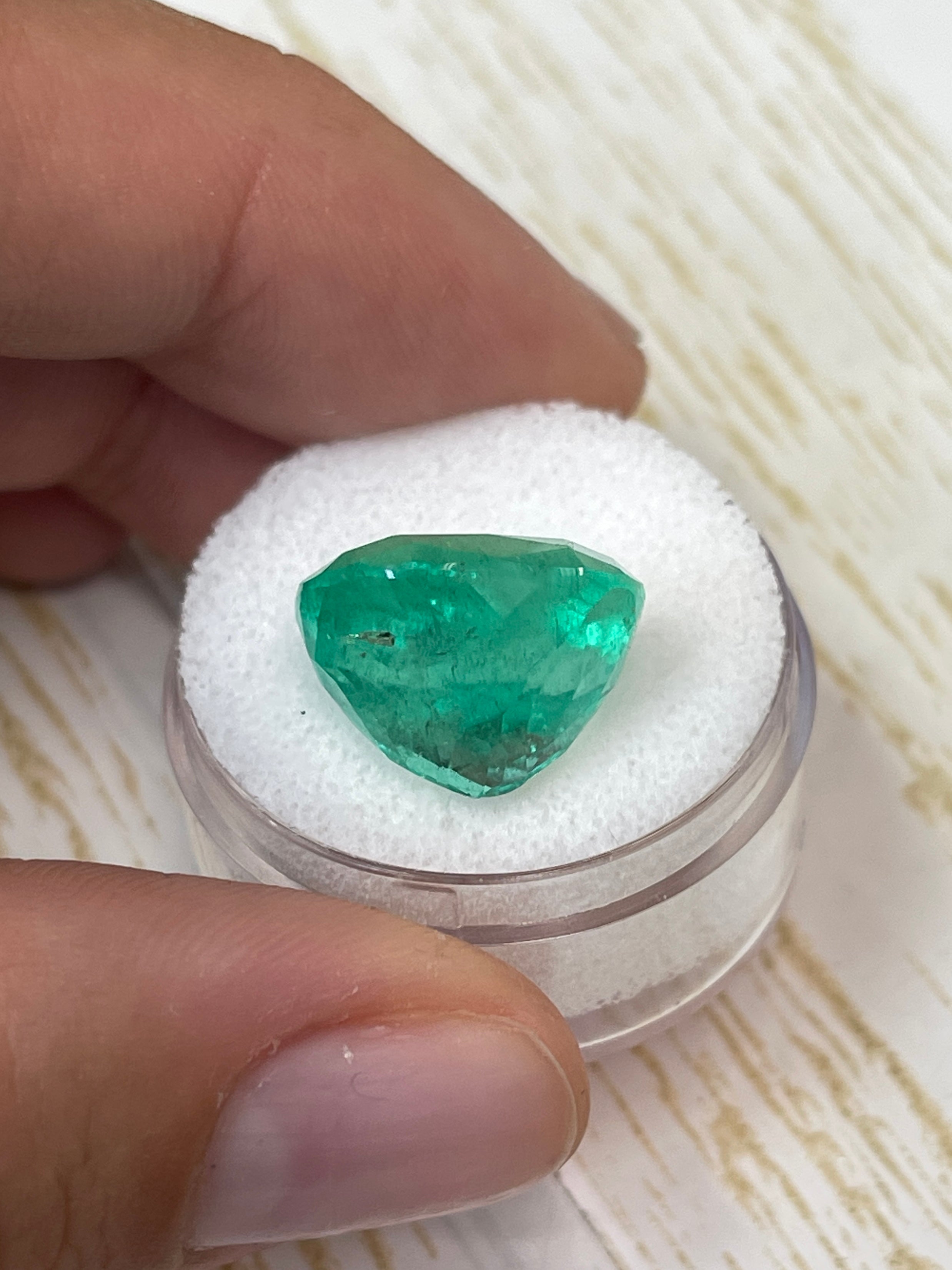 Large 13.63 carat green Colombian emerald in cushion cut, natural loose gemstone with vibrant medium green color.