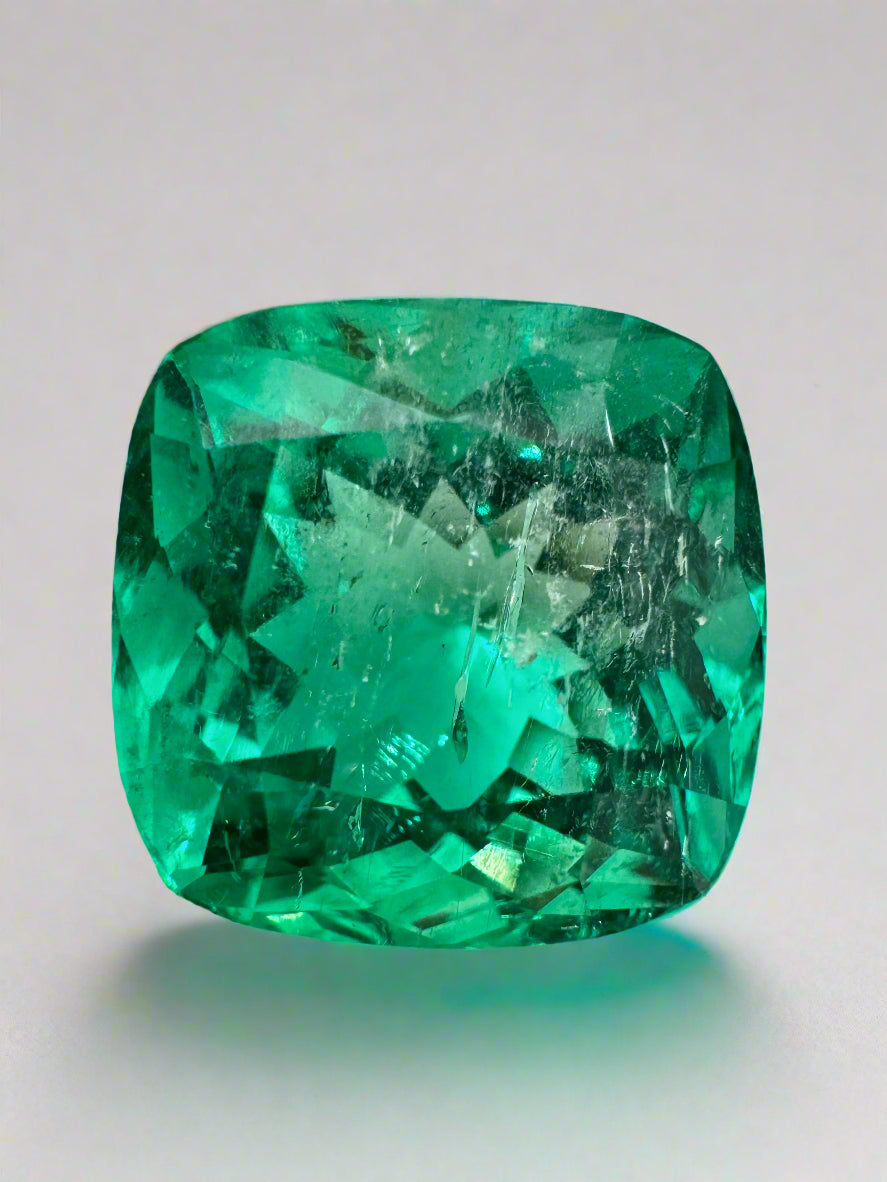 Large 13.88-carat bluish green cushion cut Colombian emerald loose gemstone from JR Colombian Emeralds, ethically mined and vibrant.