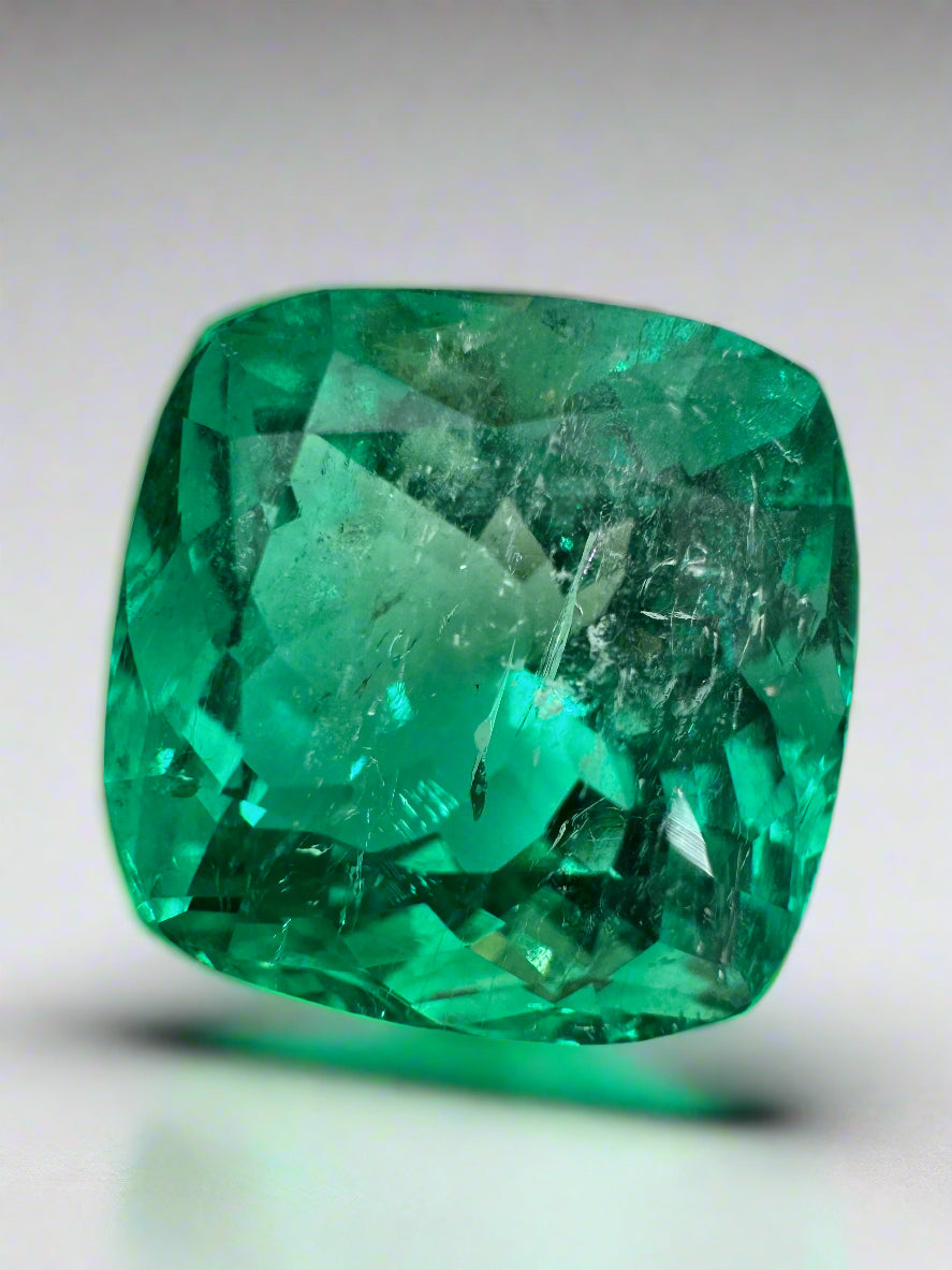 Large 13.88-carat bluish green cushion cut Colombian emerald loose gemstone by JR Colombian Emeralds, ethically mined.