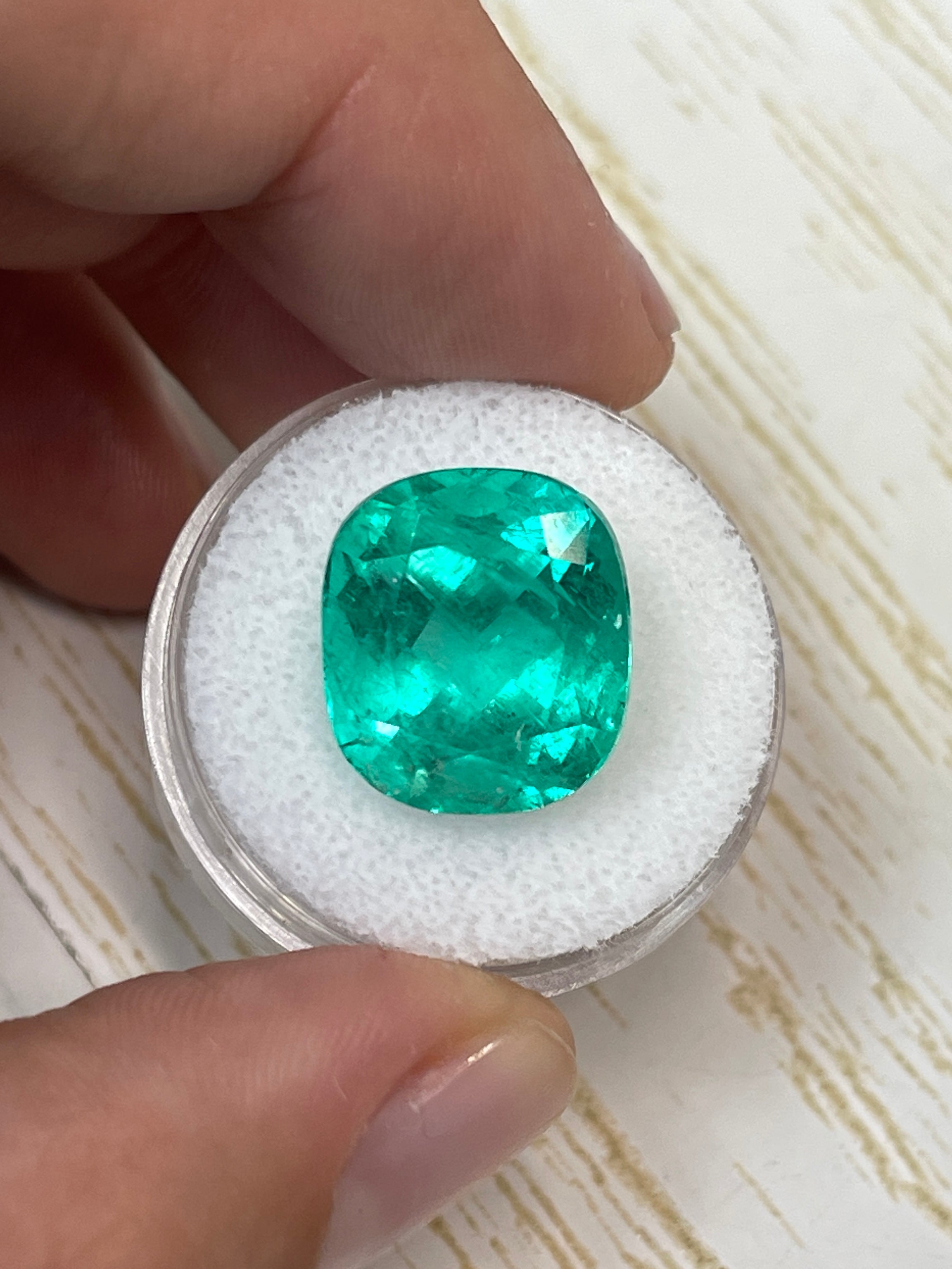 Large 14.44 carat bluish green Colombian emerald loose cushion cut gemstone from JR Colombian Emeralds.