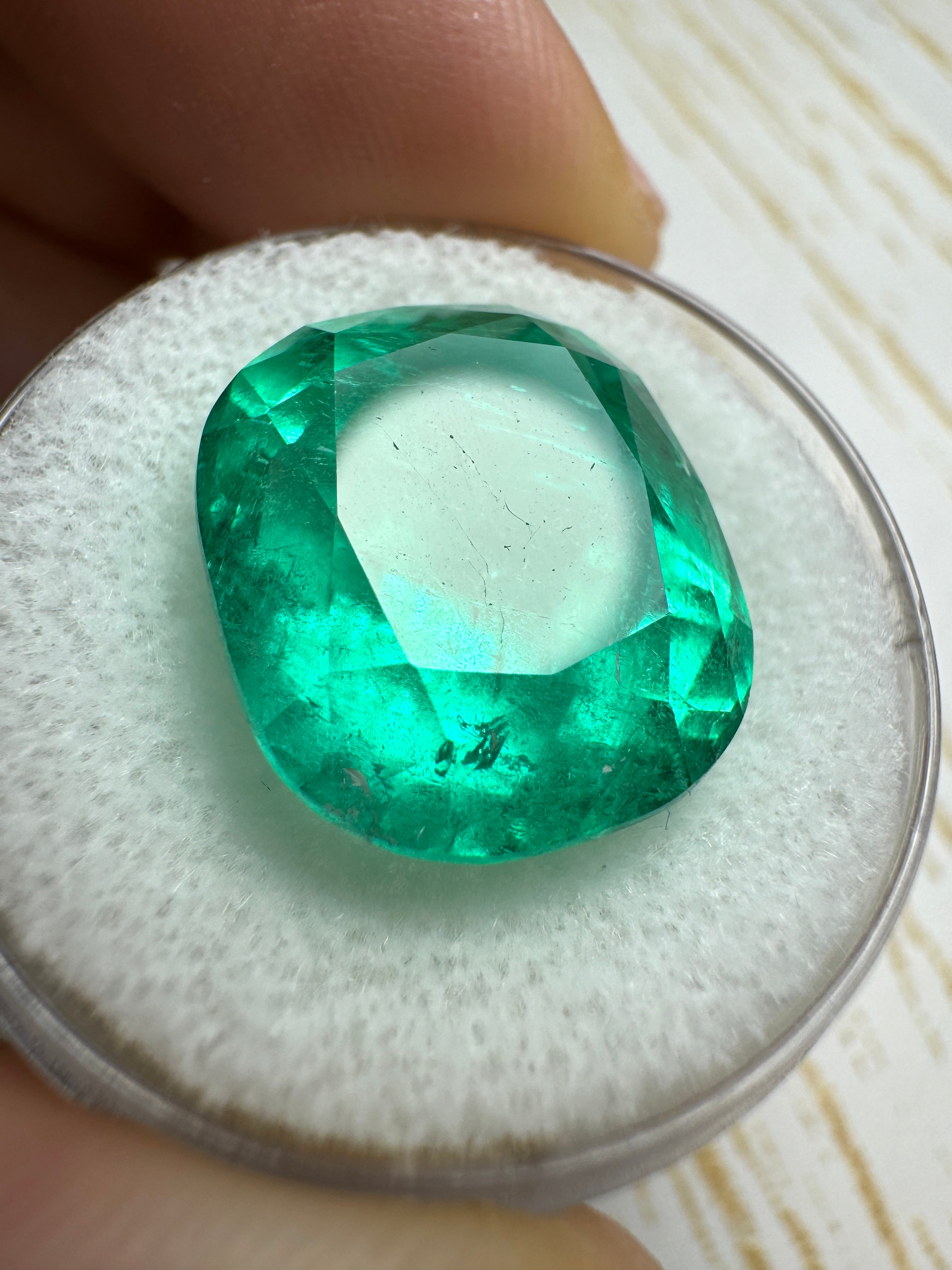 Large 14.44 carat bluish green Colombian emerald loose cushion cut gemstone from JR Colombian Emeralds.