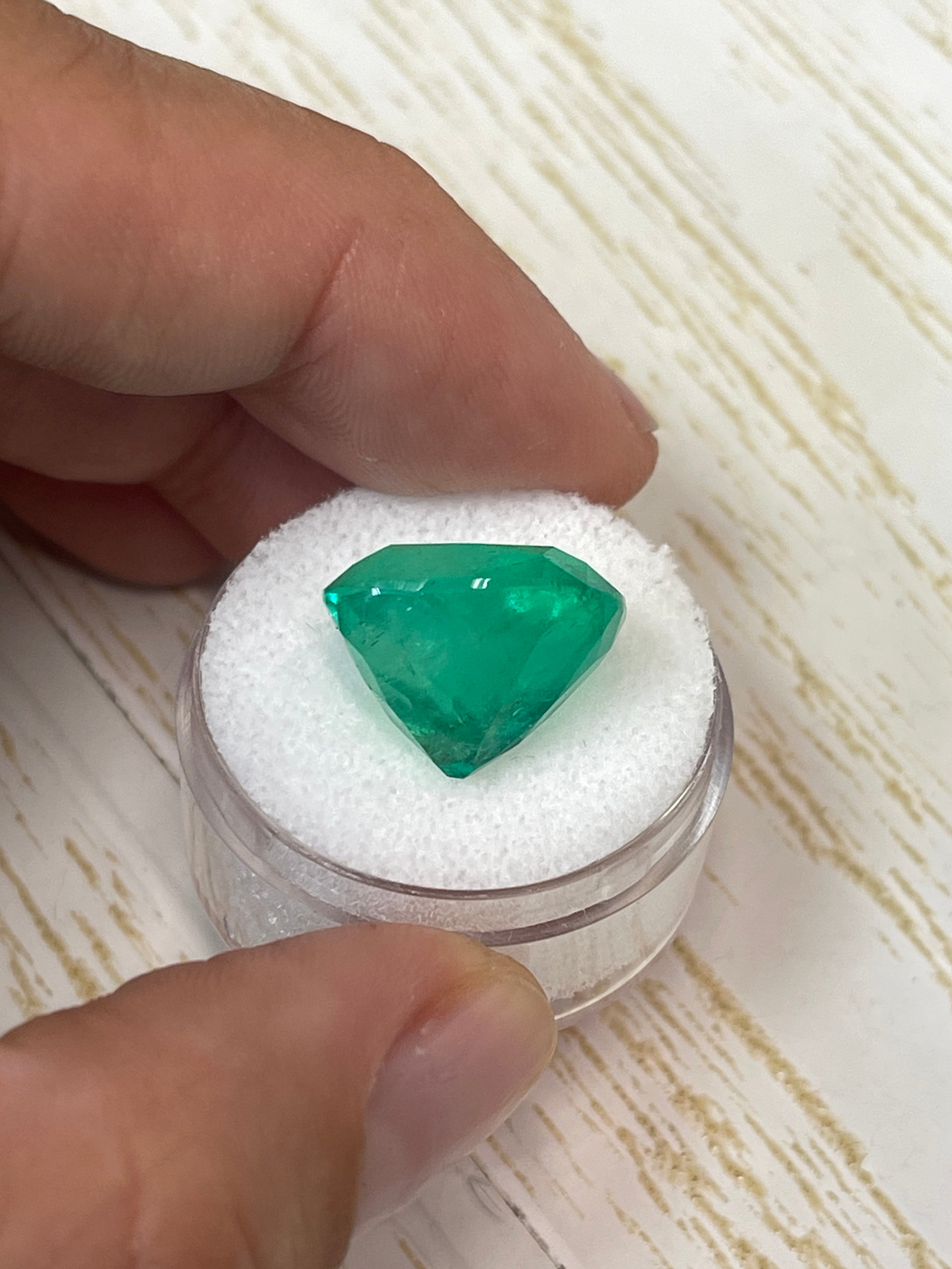 Large 14.88 ct natural Colombian emerald cushion cut gemstone from JR Colombian Emeralds, 16x13 mm size, vibrant green color.