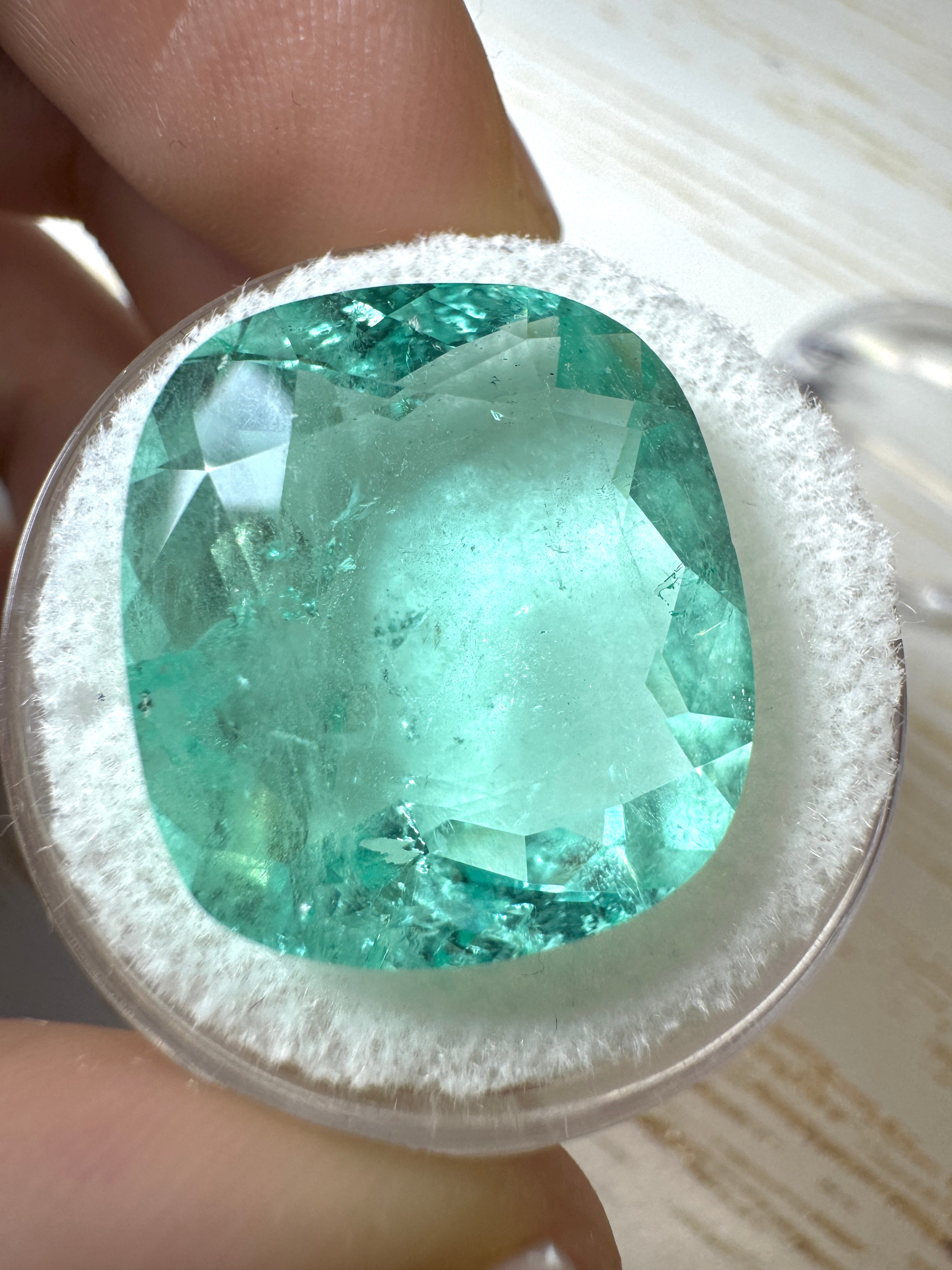 Large 19.41 carat pastel green Colombian emerald loose cushion cut gemstone from JR Colombian Emeralds.