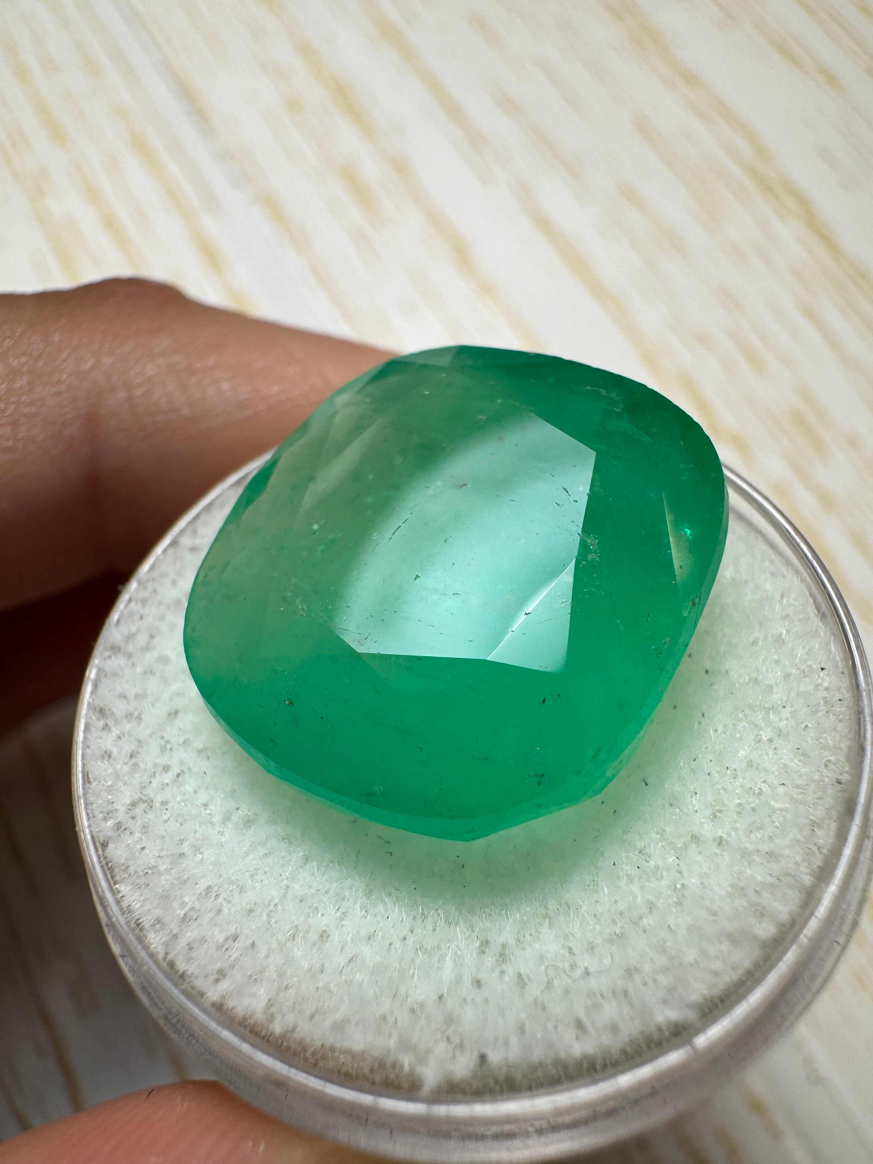 Large 21.62 carat earthy green natural Colombian emerald cushion cut loose gemstone from JR Colombian Emeralds.