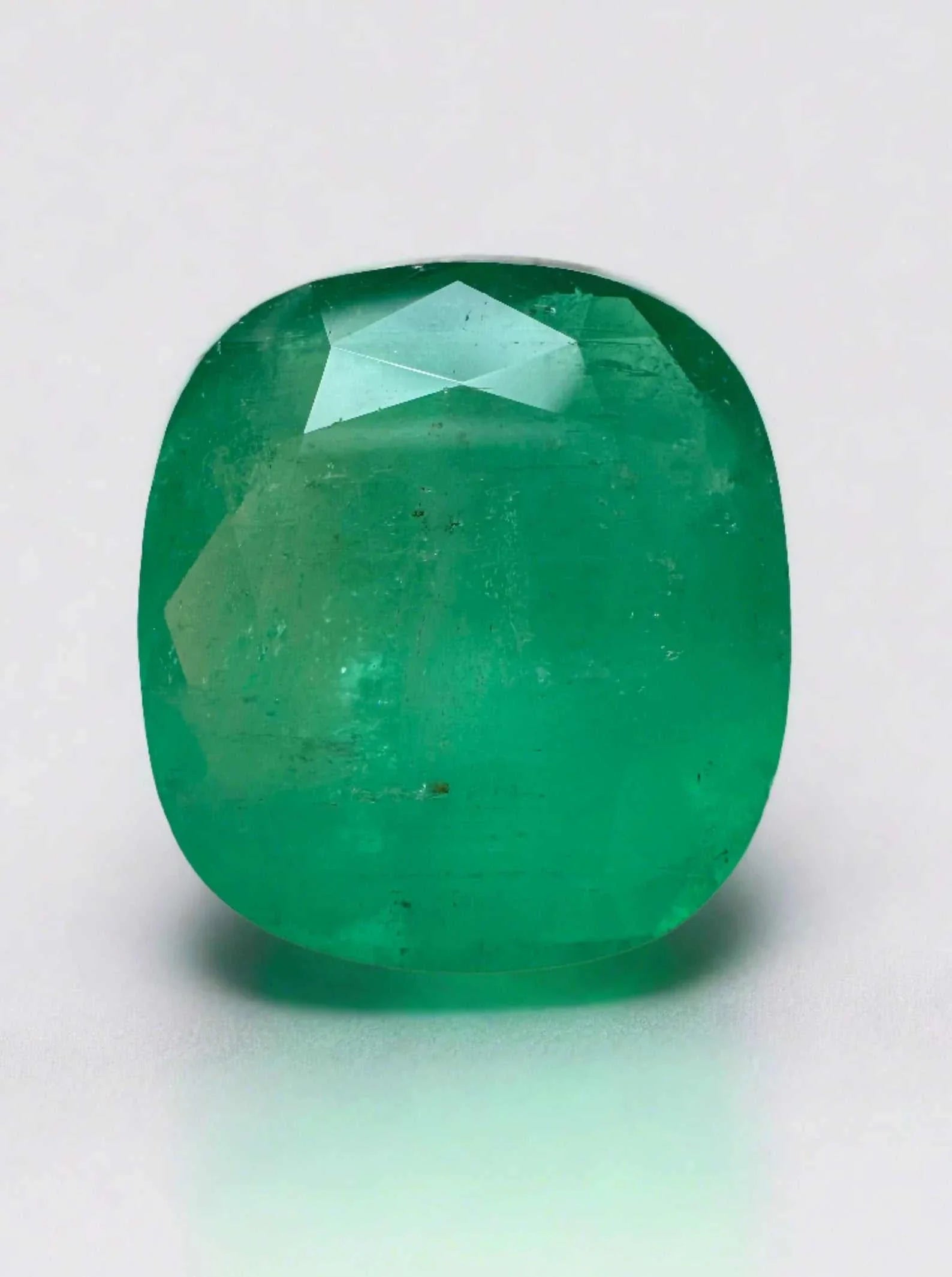 Large 21.62 carat natural Colombian emerald cushion cut gemstone in earthy medium green color
