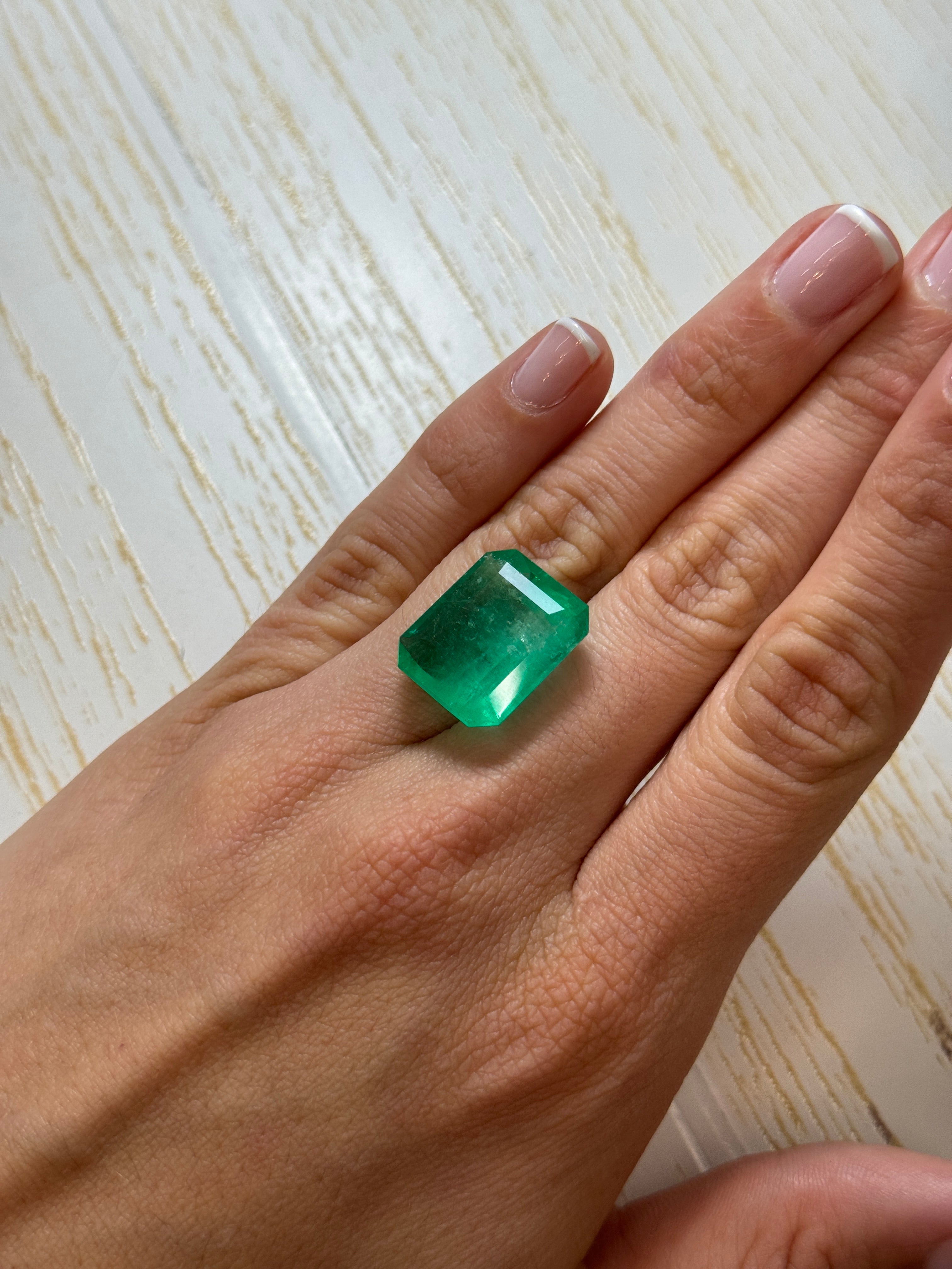 Large 22.54-carat natural Colombian emerald in an emerald cut, showcasing vibrant green color and clarity.