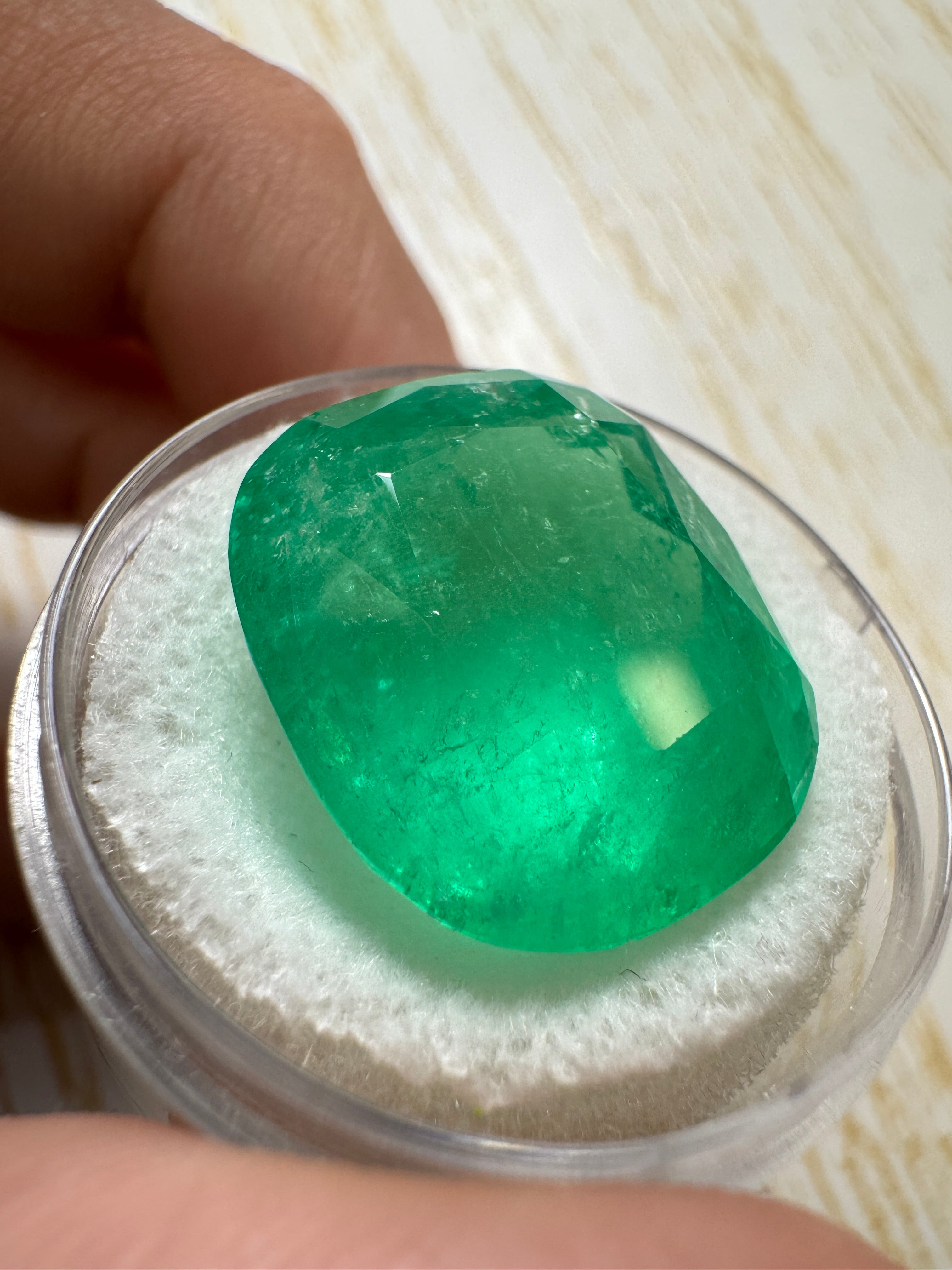 Large 22.61-carat spring green Colombian emerald, cushion cut, natural loose gemstone from JR Colombian Emeralds.