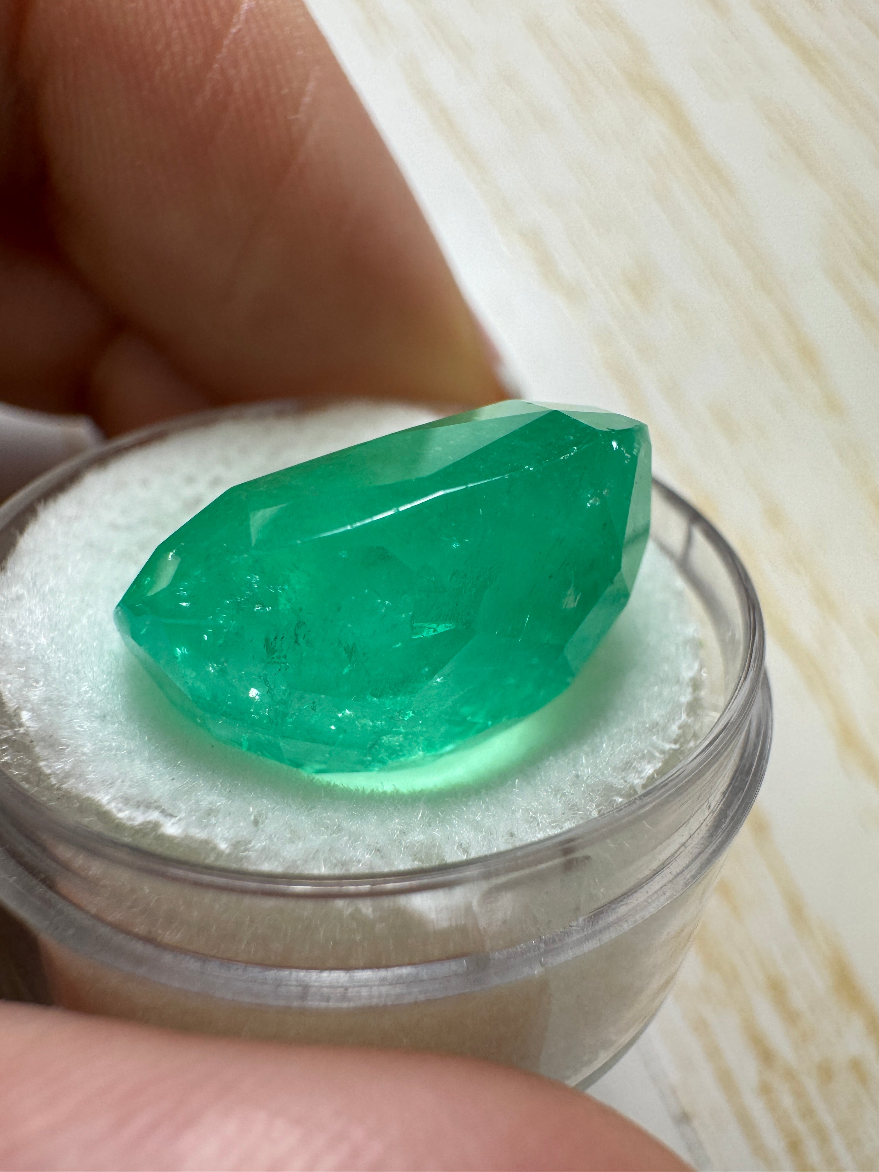 Large 22.61 carat spring green Colombian emerald loose cushion cut gemstone from JR Colombian Emeralds.