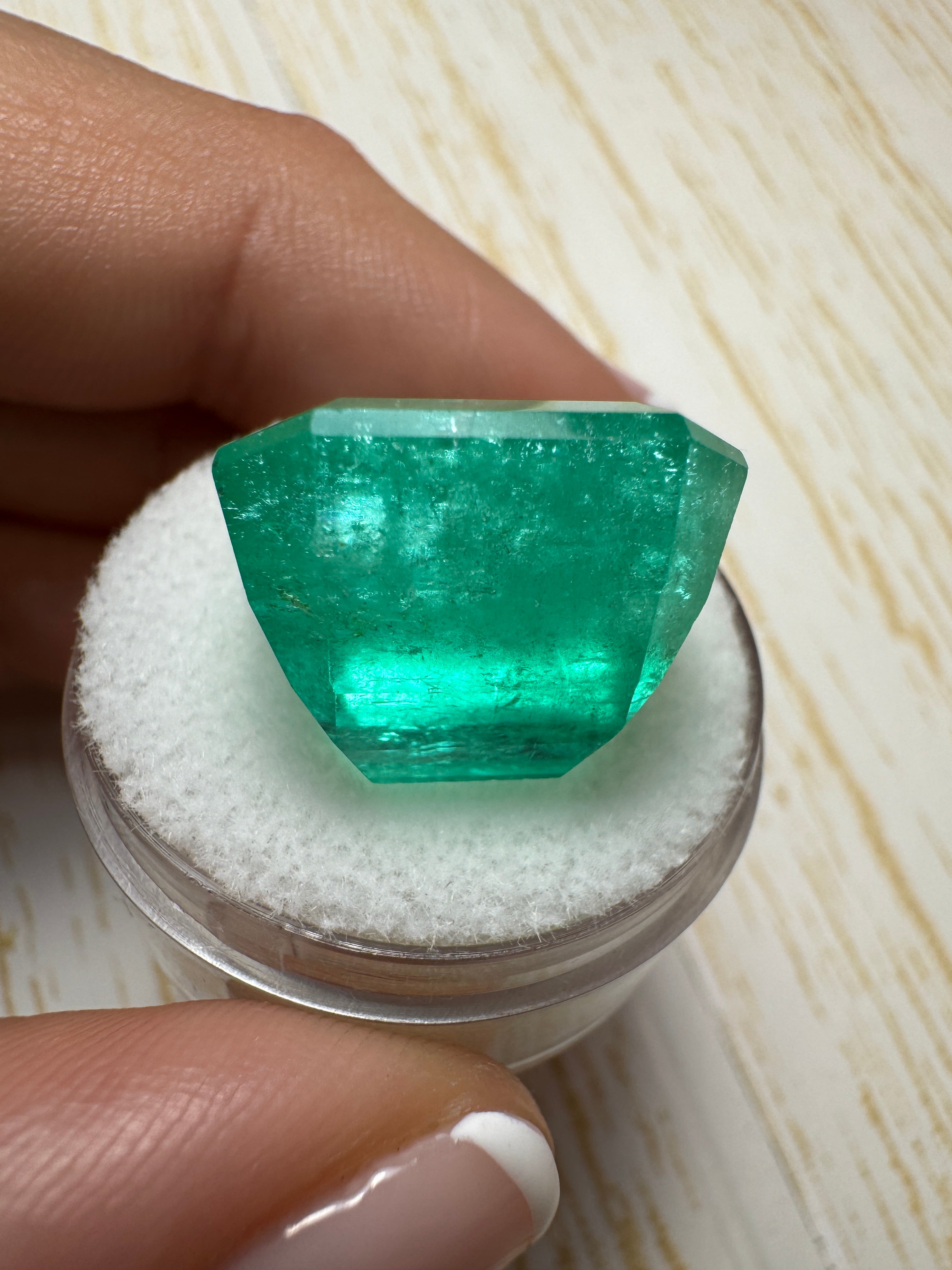 Large 23.85 carat natural Colombian emerald loose gemstone in classic emerald cut, 17x15.6 mm, from JR Colombian Emeralds.