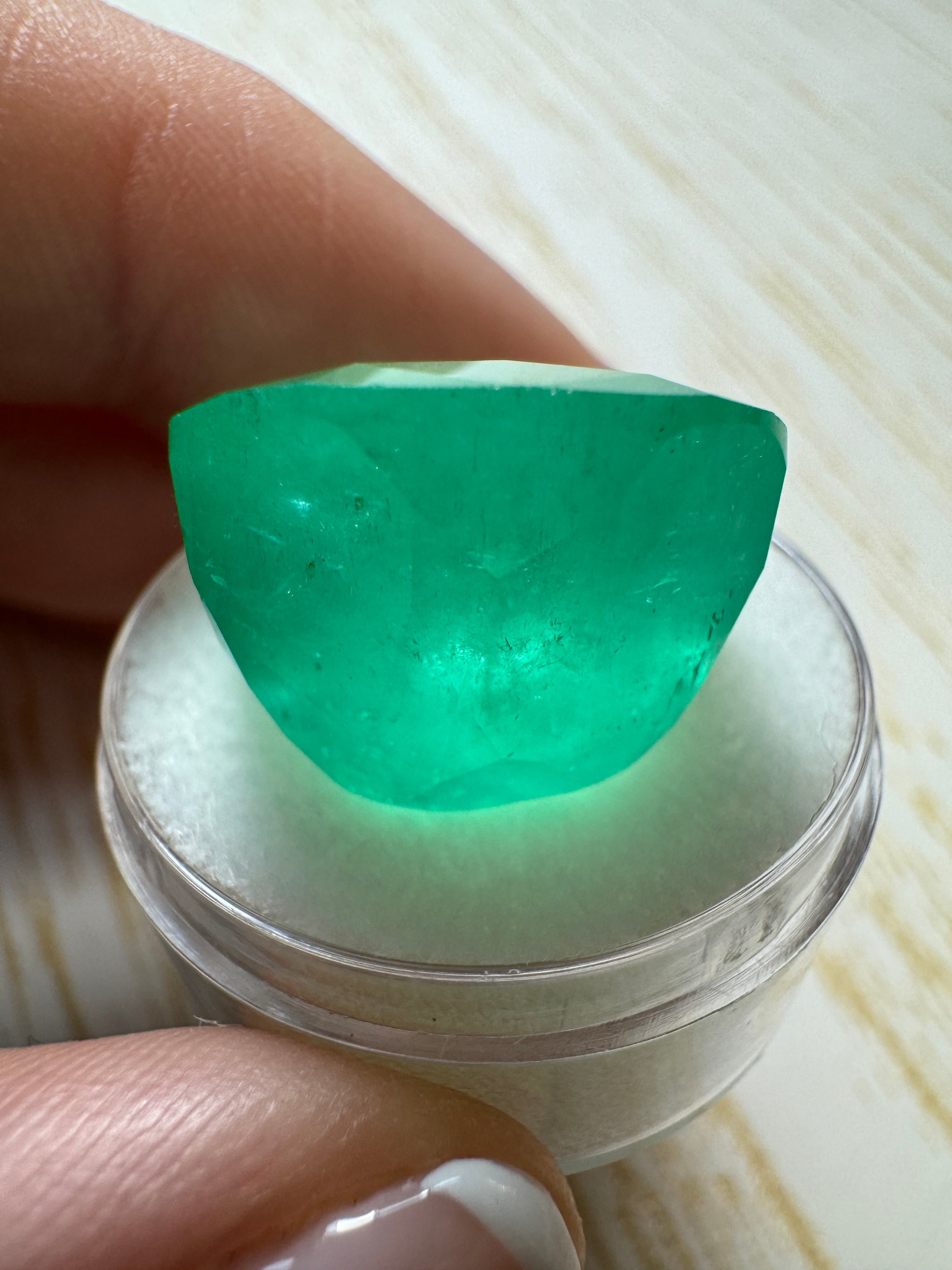 Large 30.43 carat spring green Colombian emerald loose cushion cut gemstone from JR Colombian Emeralds.