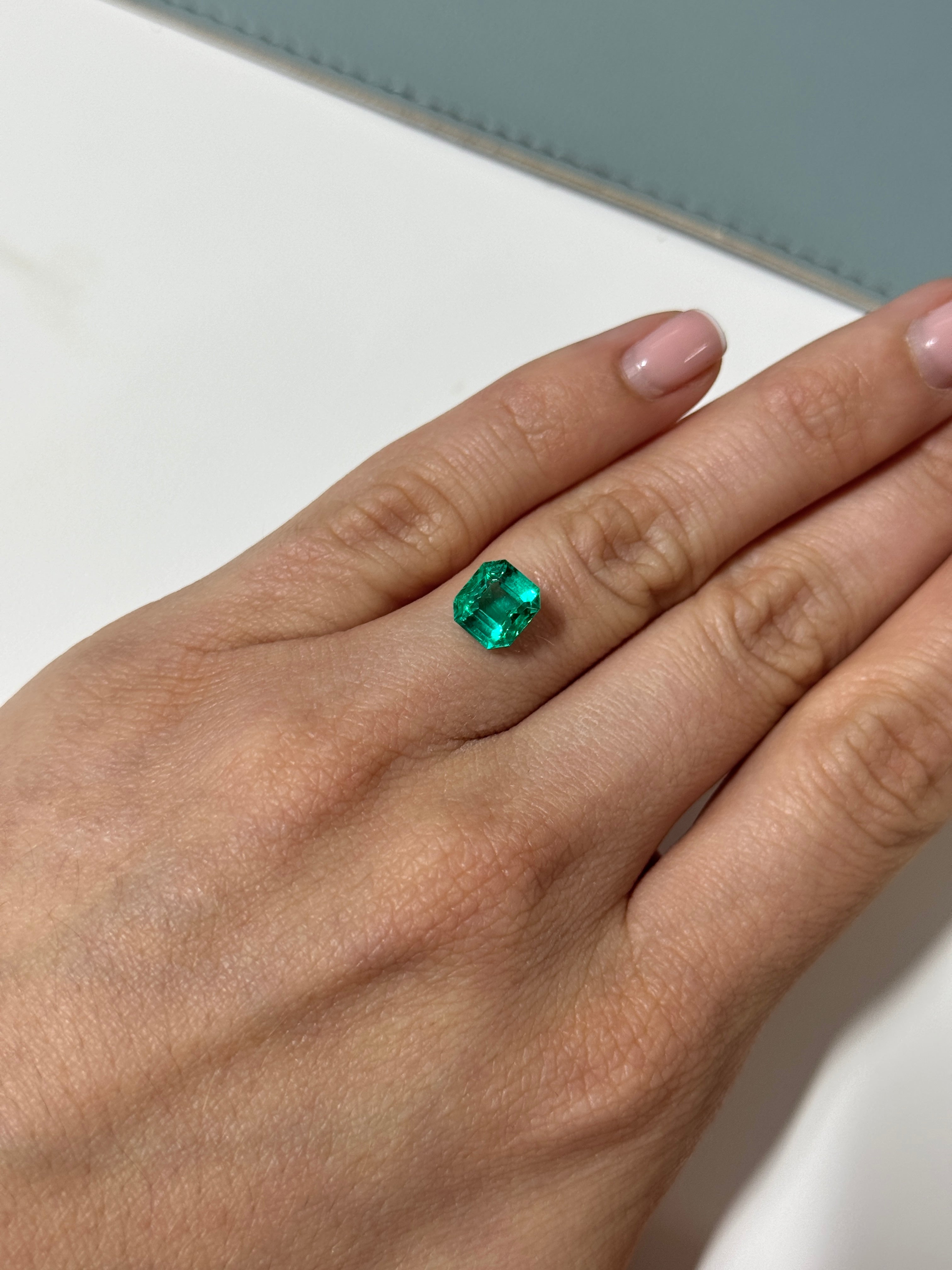 2.31 carat rare no-oil Colombian emerald Asscher cut gemstone from JR Colombian Emeralds, showcasing deep green color and clarity.