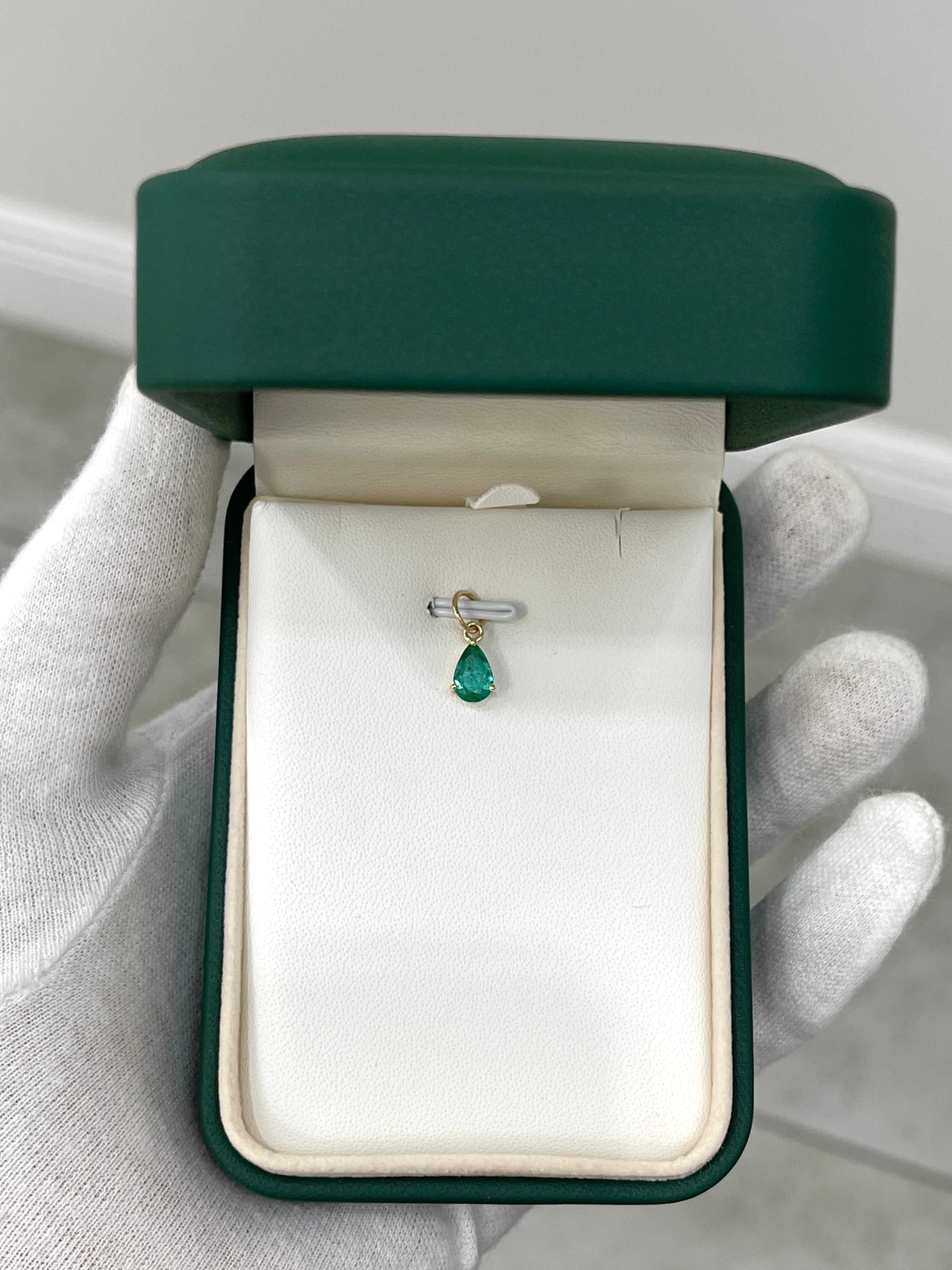 Petite 0.70ct natural freckled teardrop emerald pendant with 14K prong setting by JR Colombian Emeralds.