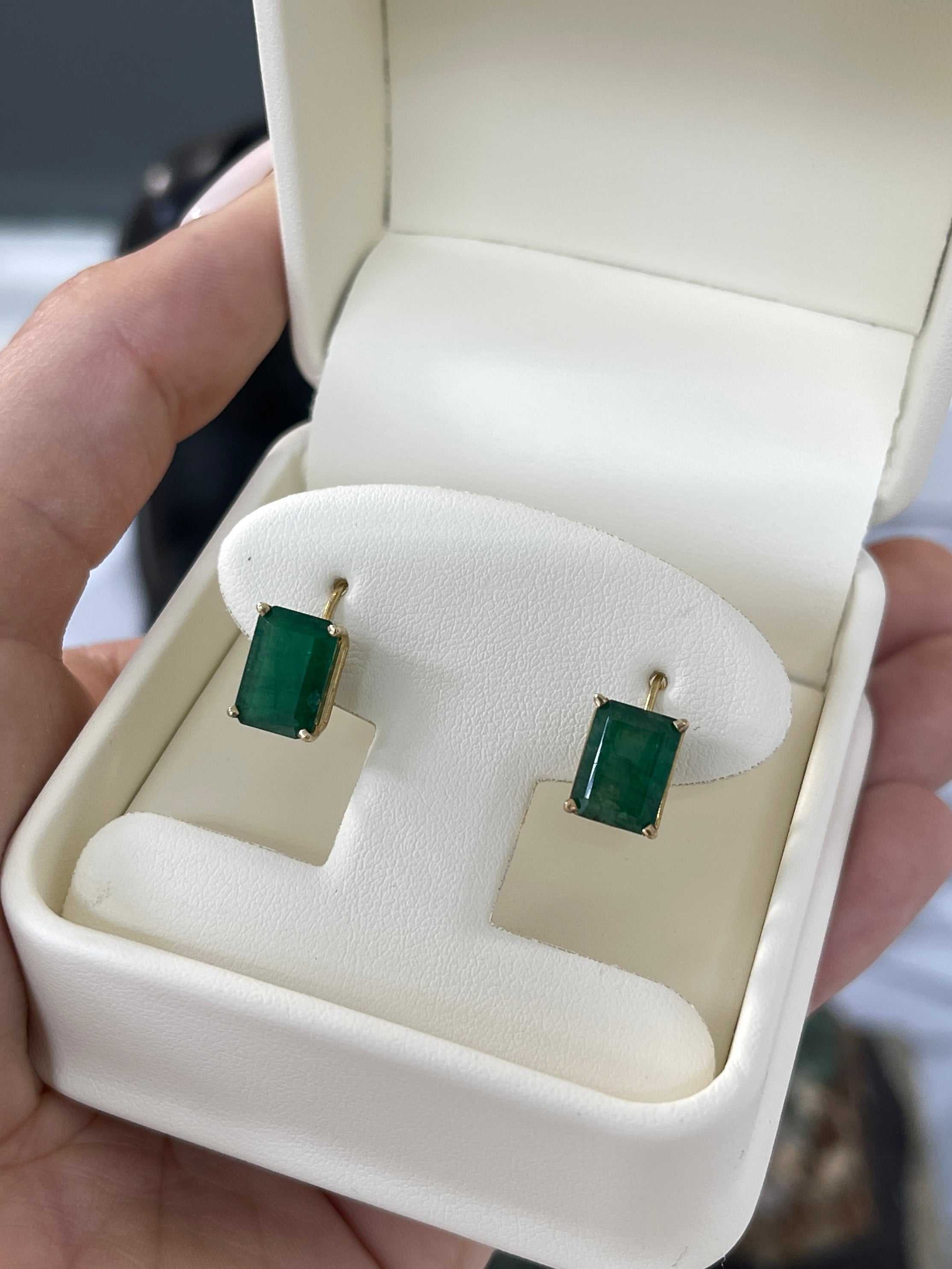 Dark green natural emerald dangle earrings with lever-back clasps, crafted in 14K gold by JR Colombian Emeralds.
