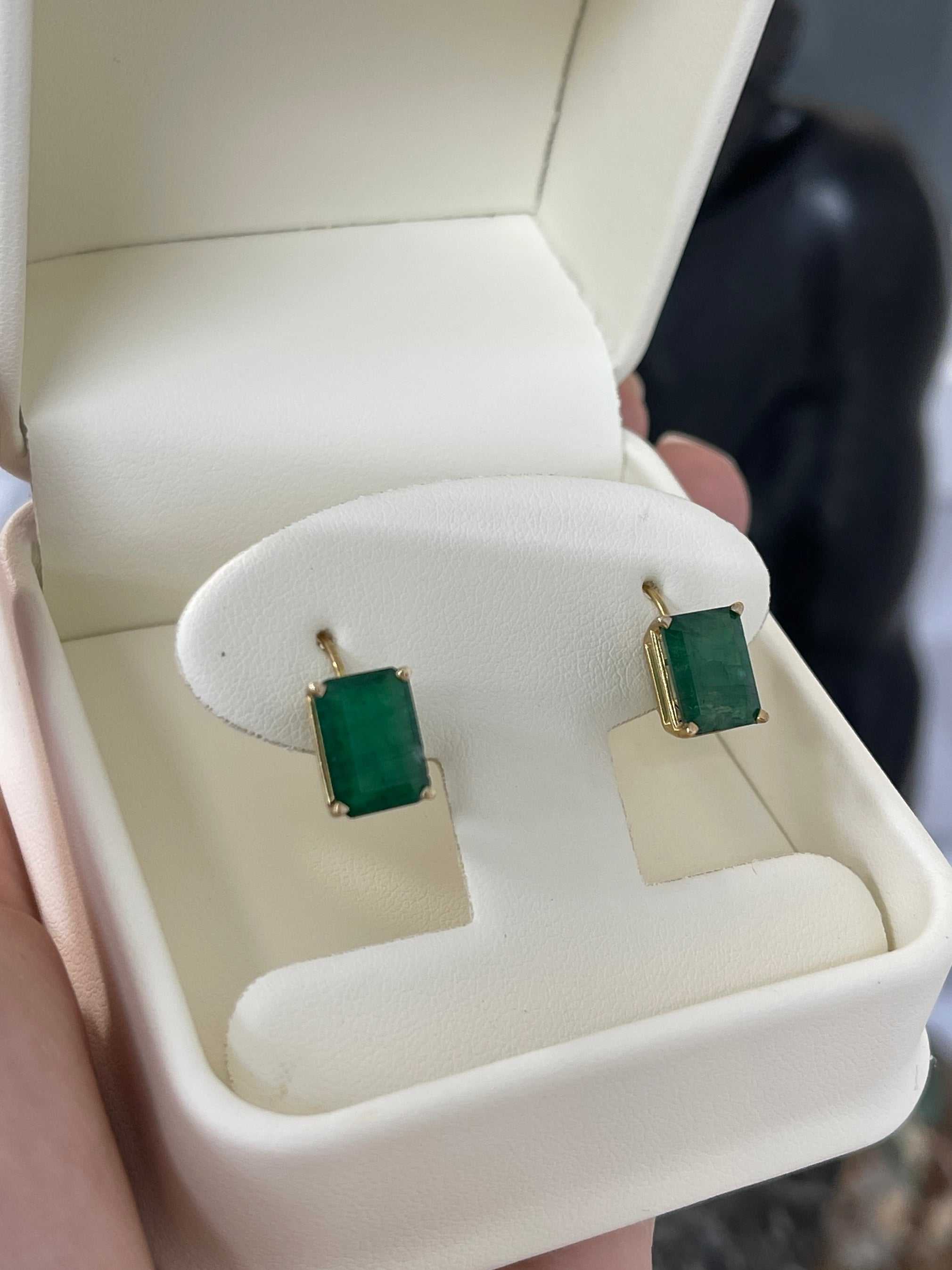 Classic dark green natural emerald lever-back dangle earrings in 14K gold featuring 3.43 tcw emeralds by JR Colombian Emeralds.