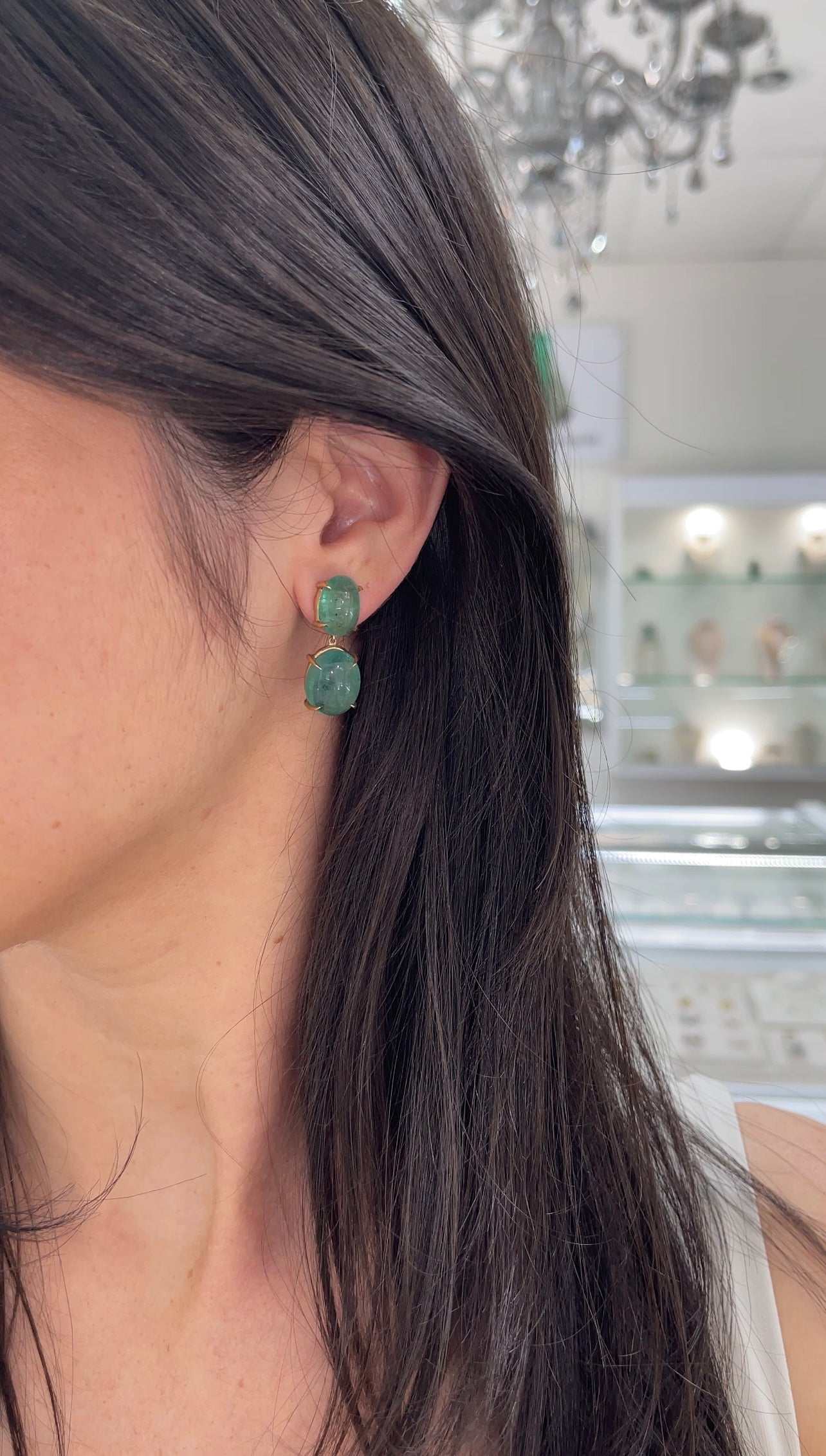 JR Colombian Emeralds dangle earrings with large natural cabochon emeralds in 14K gold, as seen on Instagram.