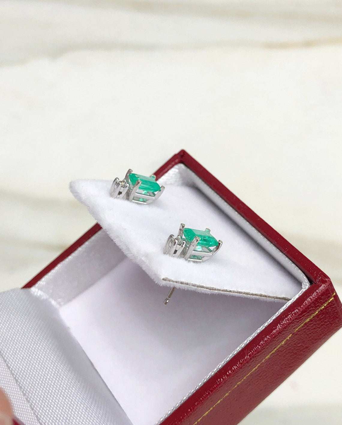 JR Colombian Emeralds 14K white gold stud earrings with 1.56 carats of earth mined emeralds and diamonds, detailed gemstone settings.