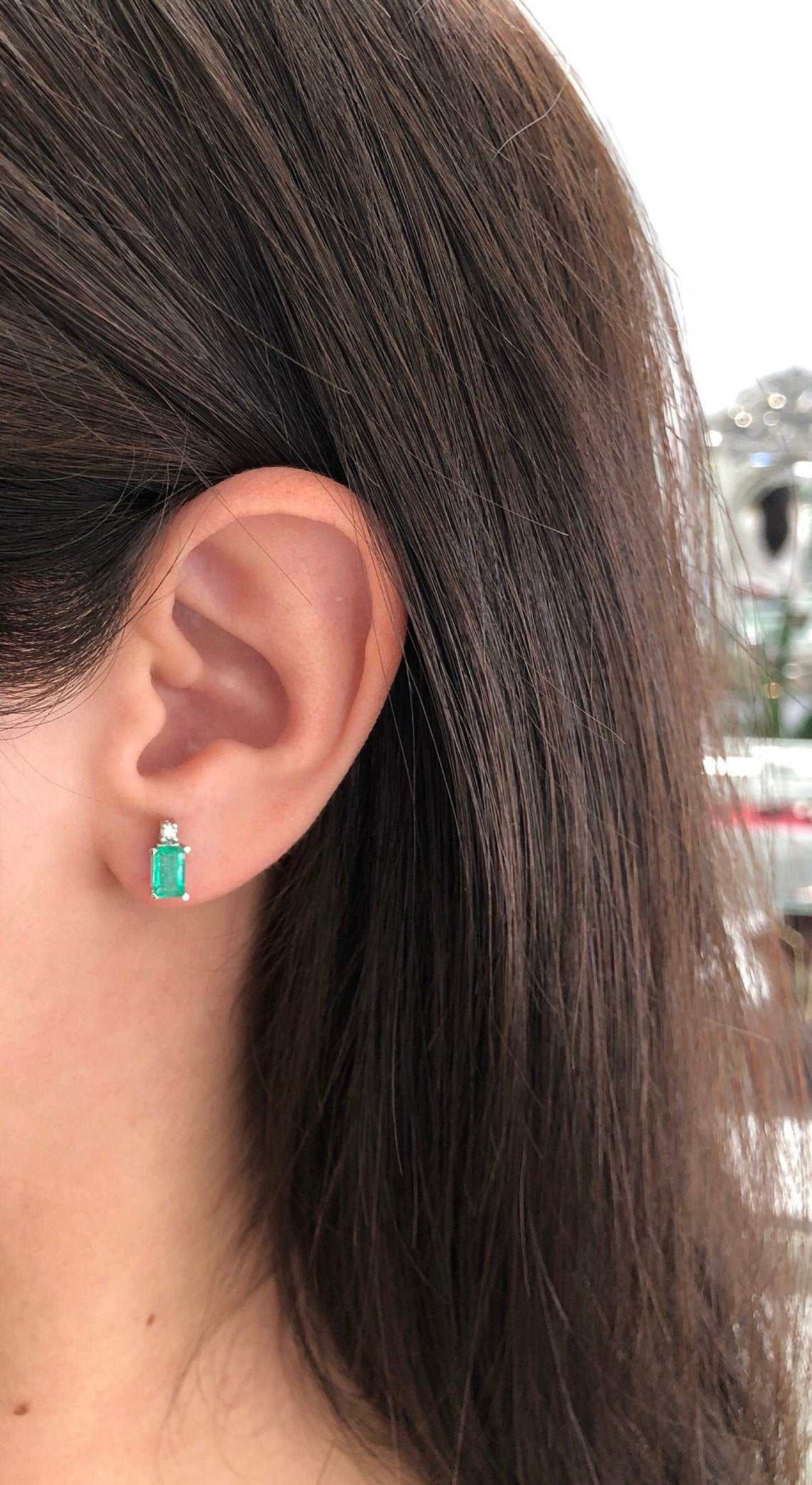 JR Colombian Emeralds 14K white gold stud earrings with 1.56tcw earth-mined emeralds and diamonds, showcasing elegant gemstone details.