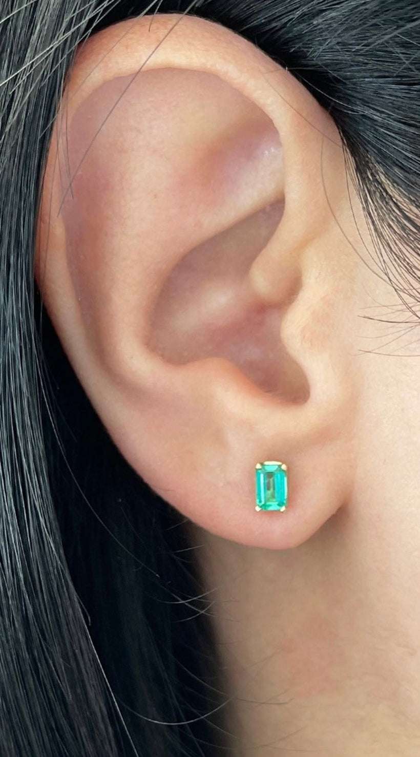 14K yellow gold emerald cut stud earrings with four prongs, featuring 0.80tcw diamonds, by JR Colombian Emeralds.