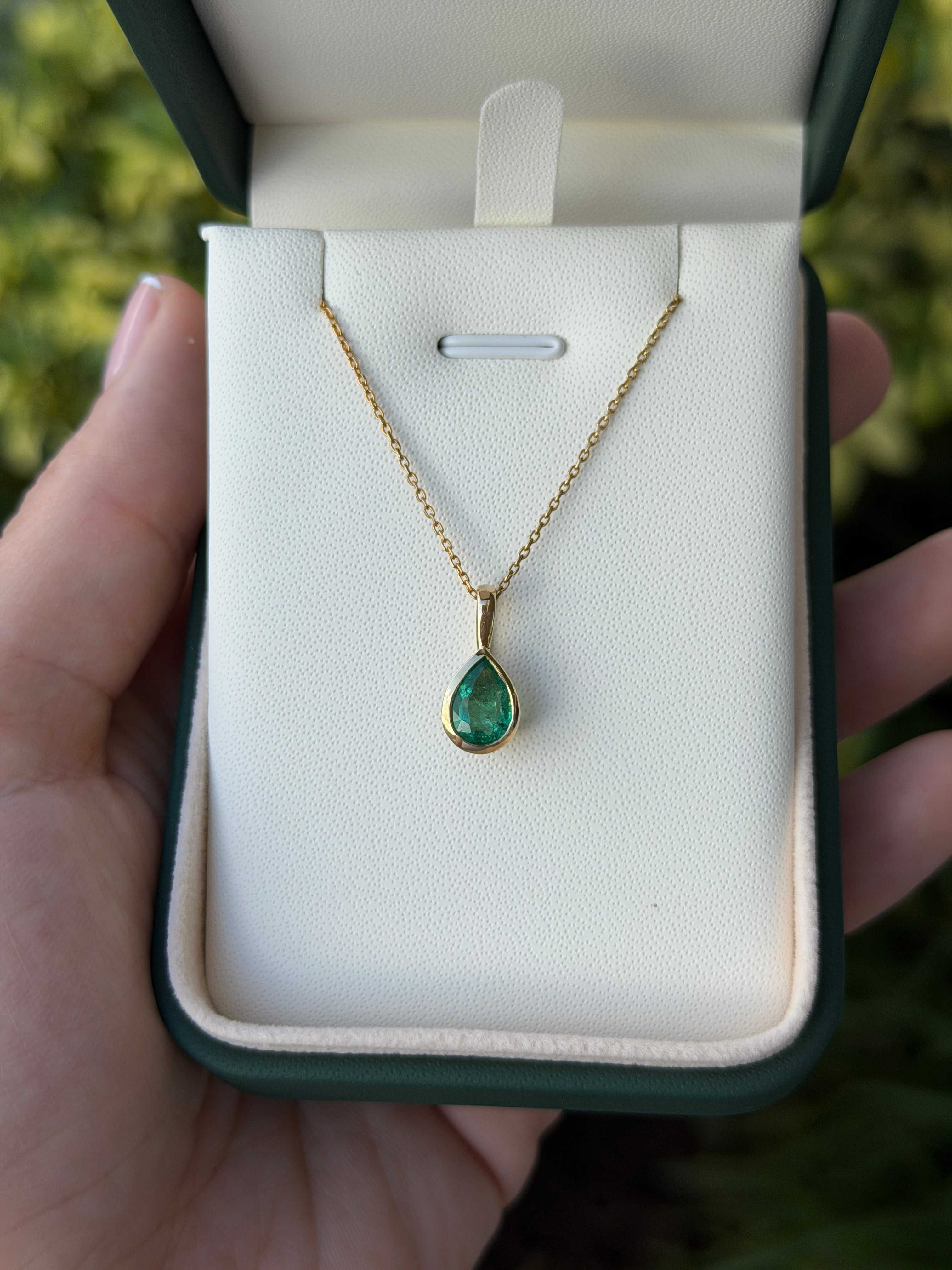 Natural emerald pear pendant necklace with 1.0ct bezel set in 14K gold by JR Colombian Emeralds.