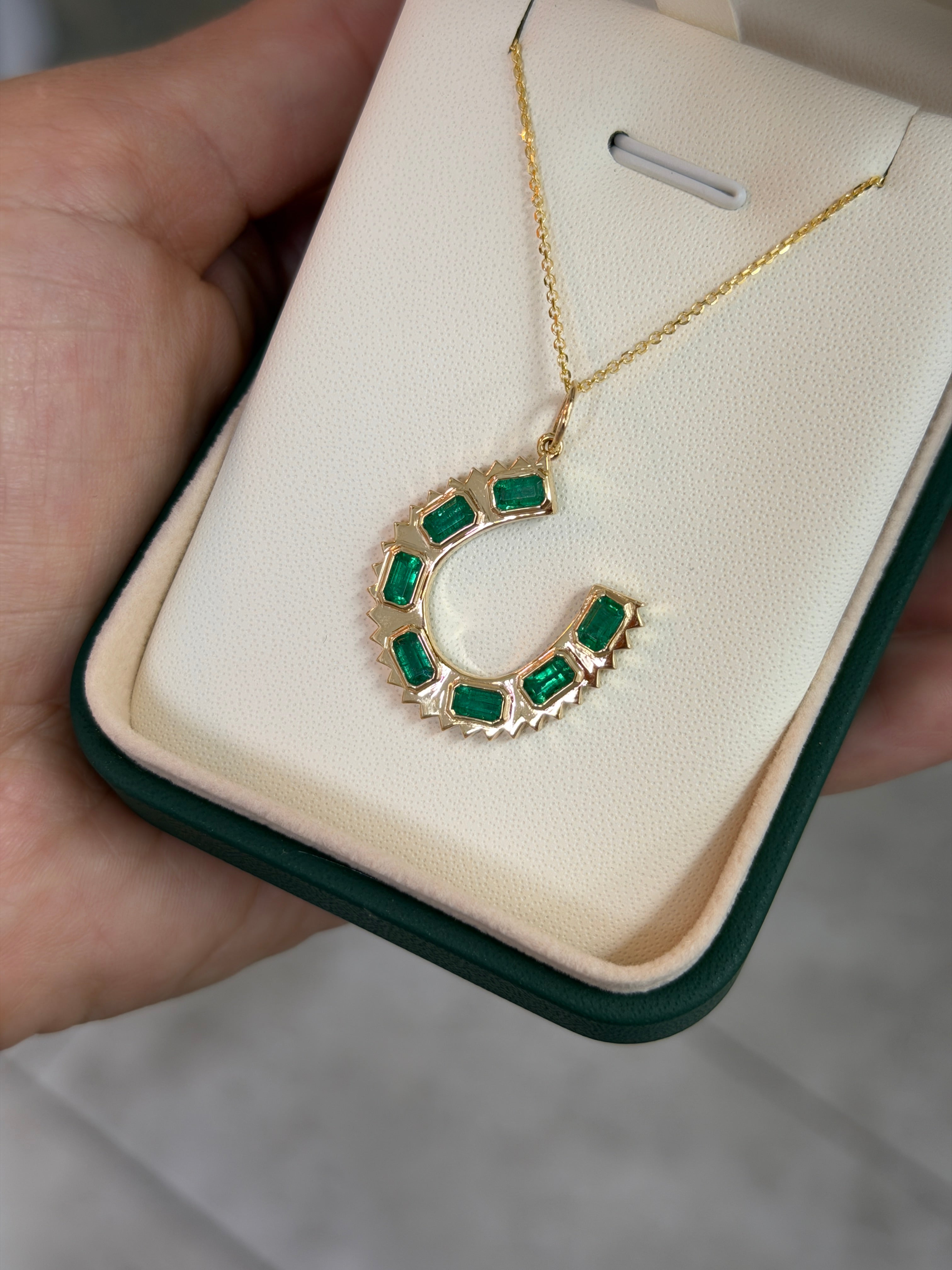 14K natural emerald cut horseshoe charm pendant necklace with 2.24tcw emeralds by JR Colombian Emeralds.