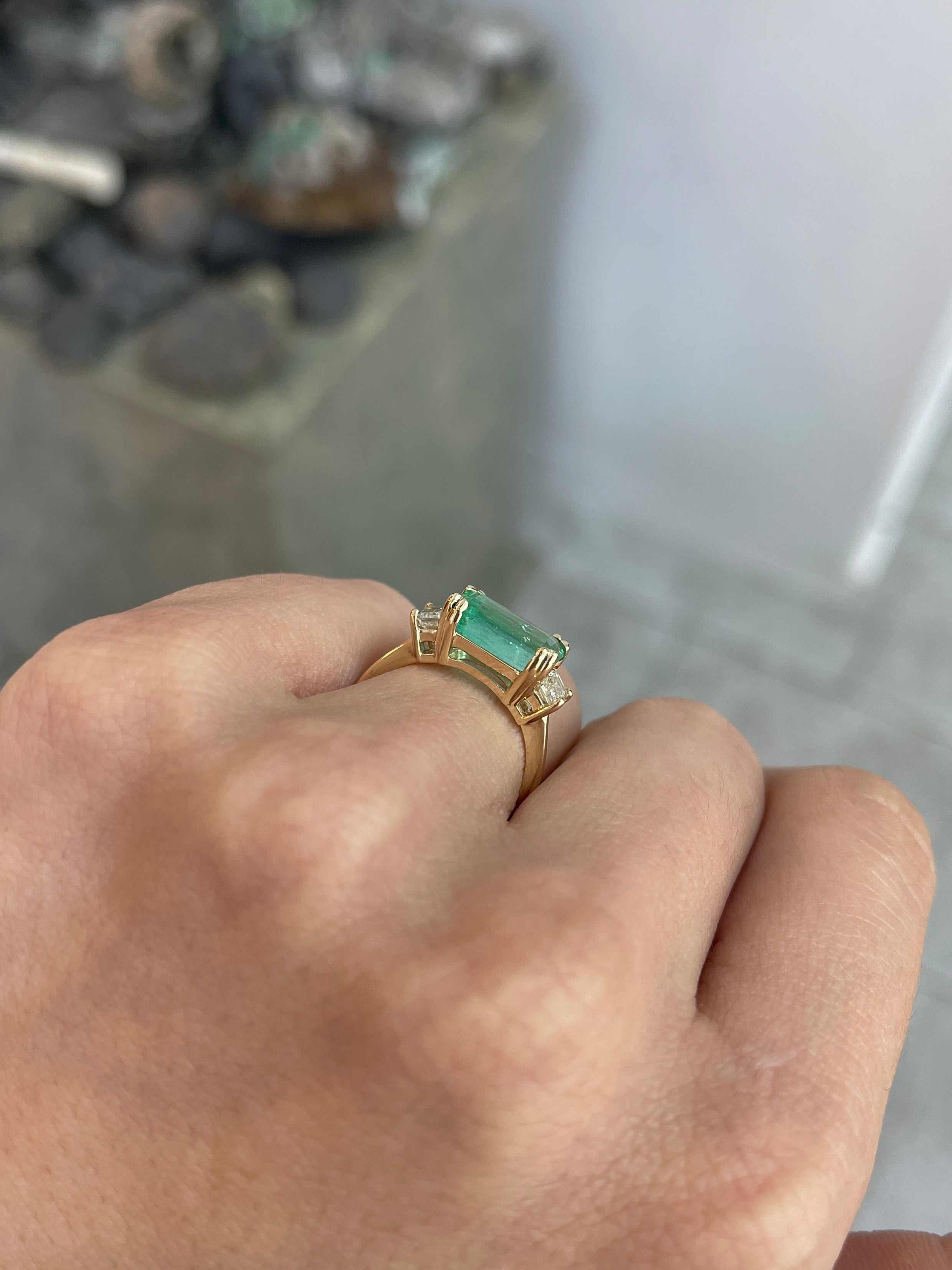 Three stone emerald and diamond engagement ring by JR Colombian Emeralds in 14K gold, showcasing vibrant emeralds and cut diamonds.