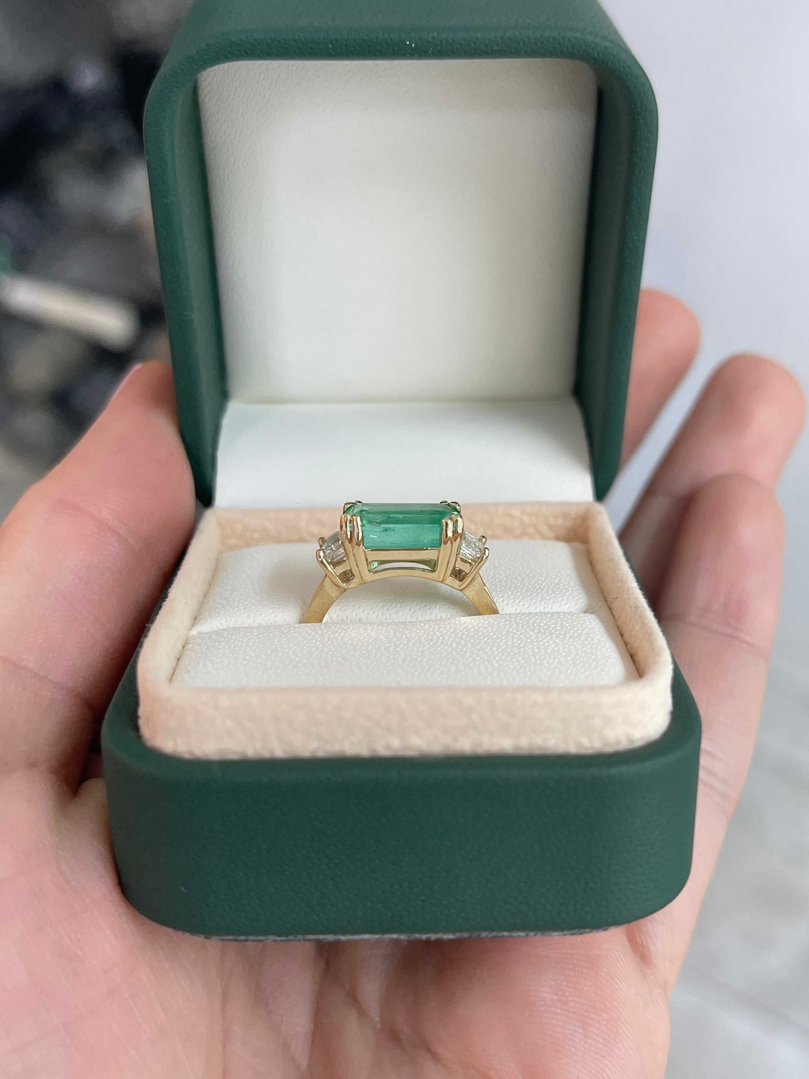 Three stone emerald and diamond engagement ring by JR Colombian Emeralds, featuring 3.64tcw in 14K gold.