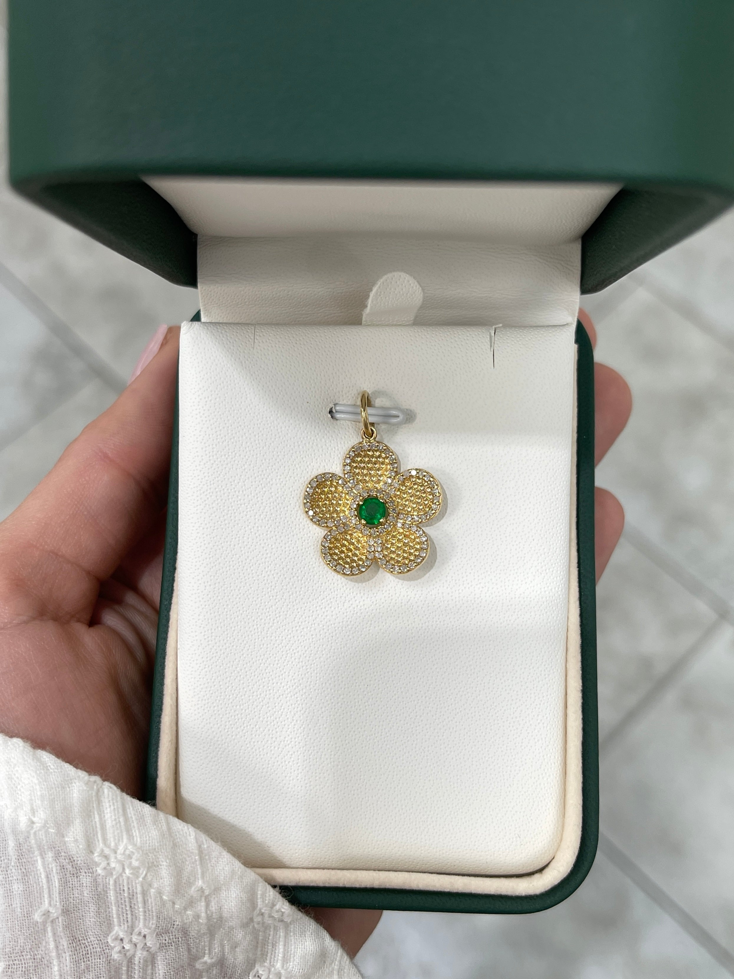 14K gold flower pendant with 0.58tcw emerald and diamond accents, jewelry piece by JR Colombian Emeralds.