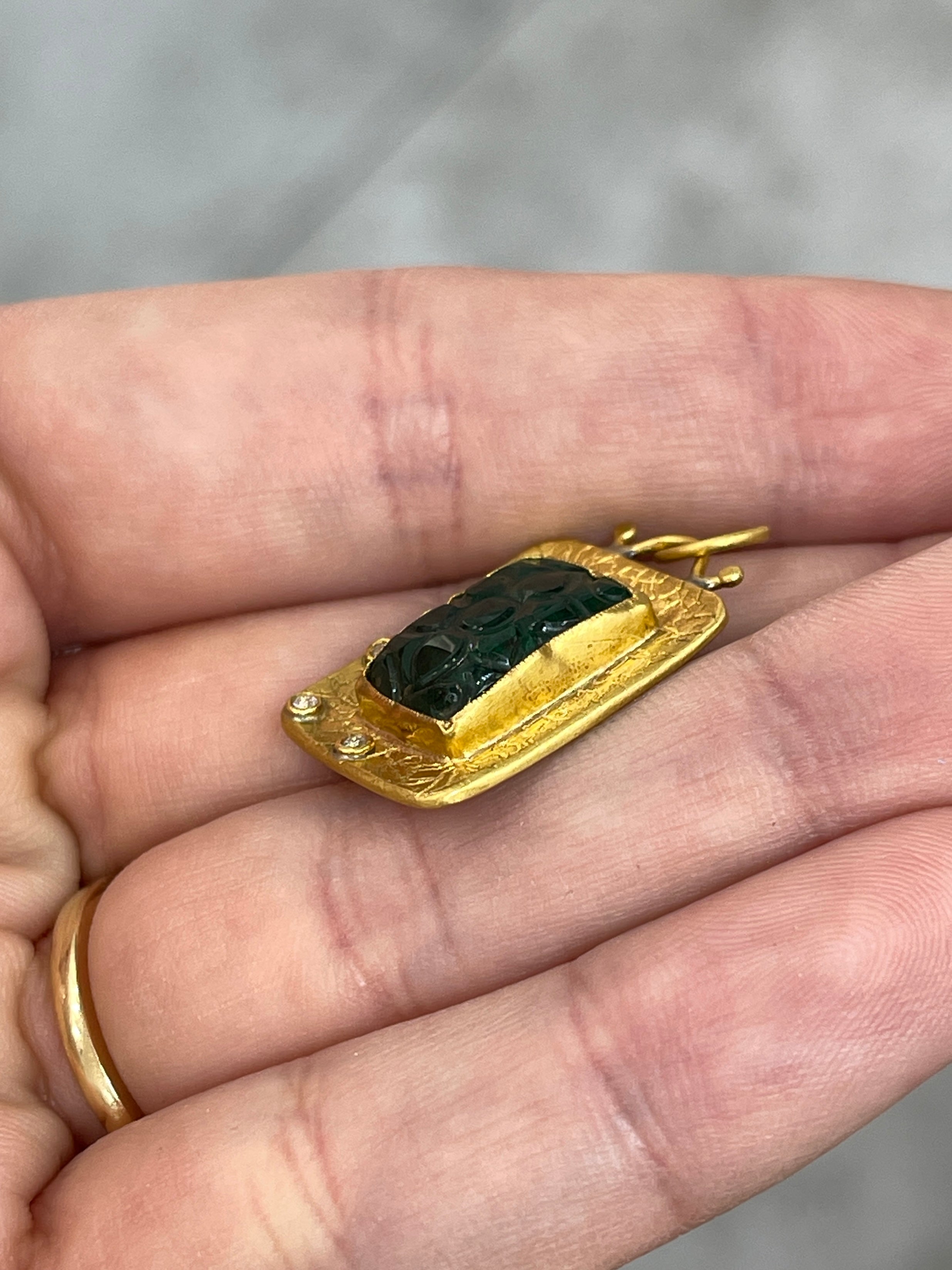 Floral hand-carved emerald and diamond pendant in 24K gold by JR Colombian Emeralds, showcasing intricate craftsmanship.