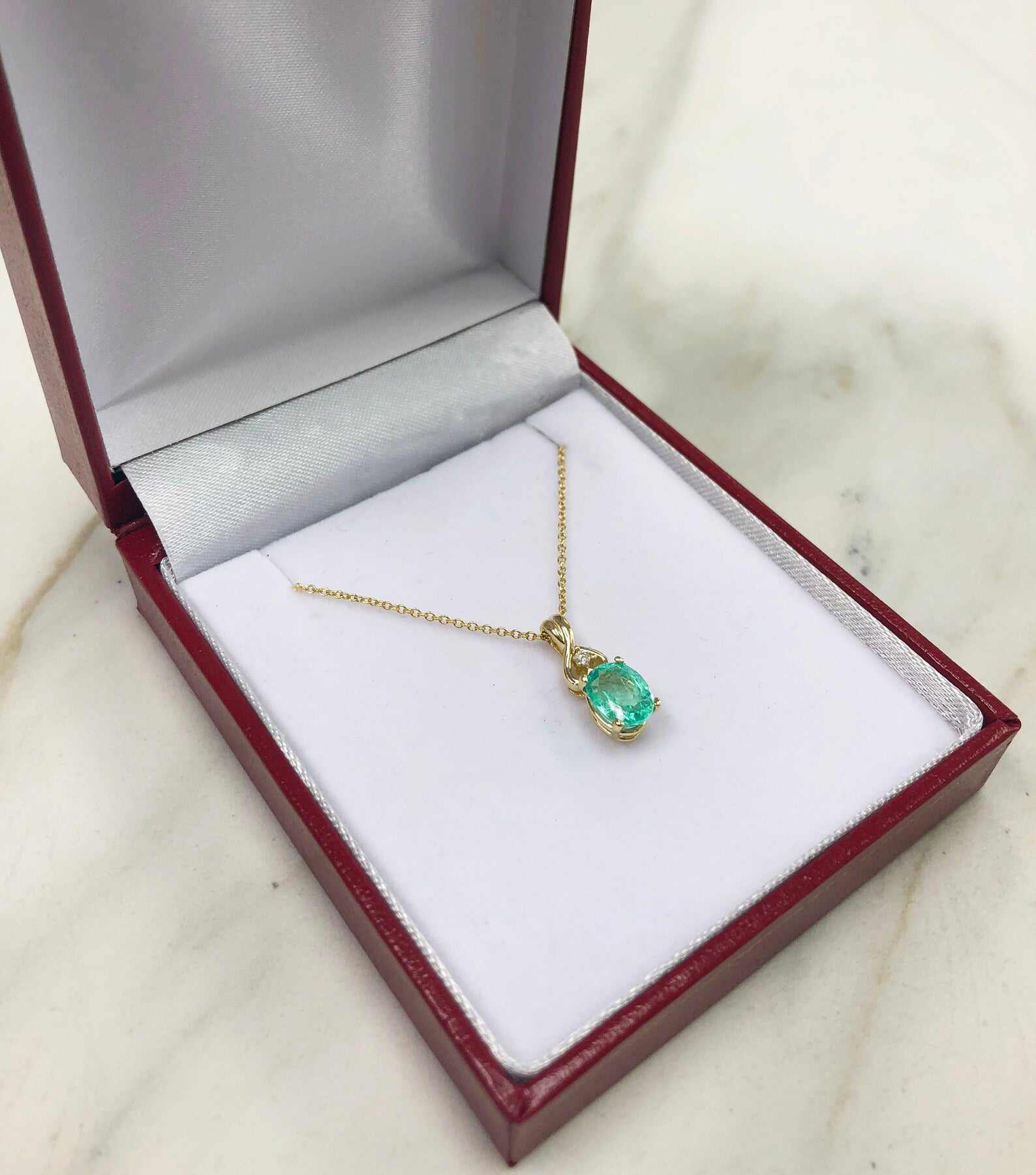 1.43tcw Natural Rich Green Emerald Oval Accented Round Diamond Pendant 14K