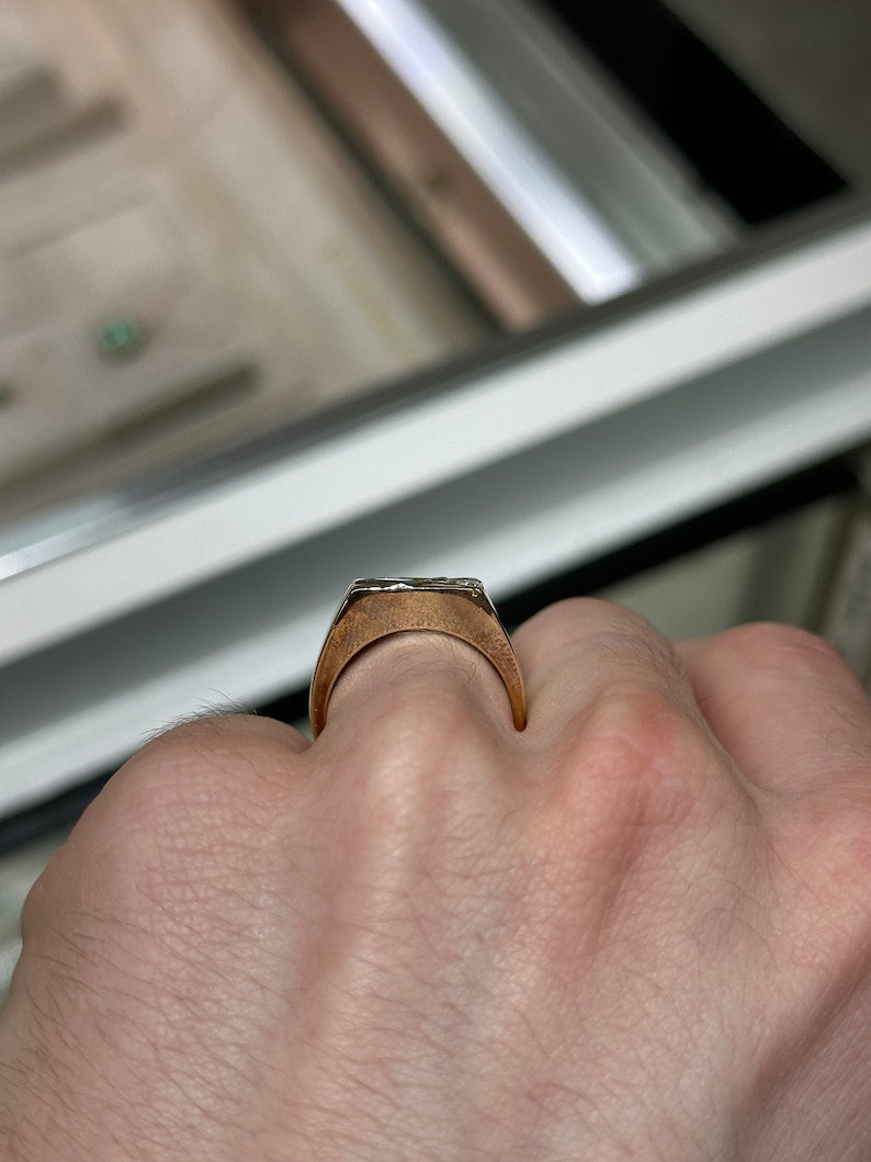 14K gold men's signet ring with round cut emerald and diamond accents, featuring lush green gemstone and elegant design.