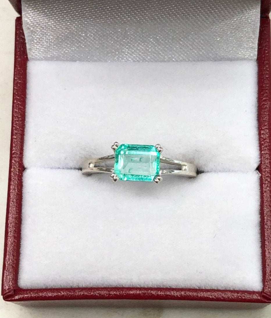 1.25 Carat Emerald Cut Emerald East To West Four Prong Double Shank Ri
