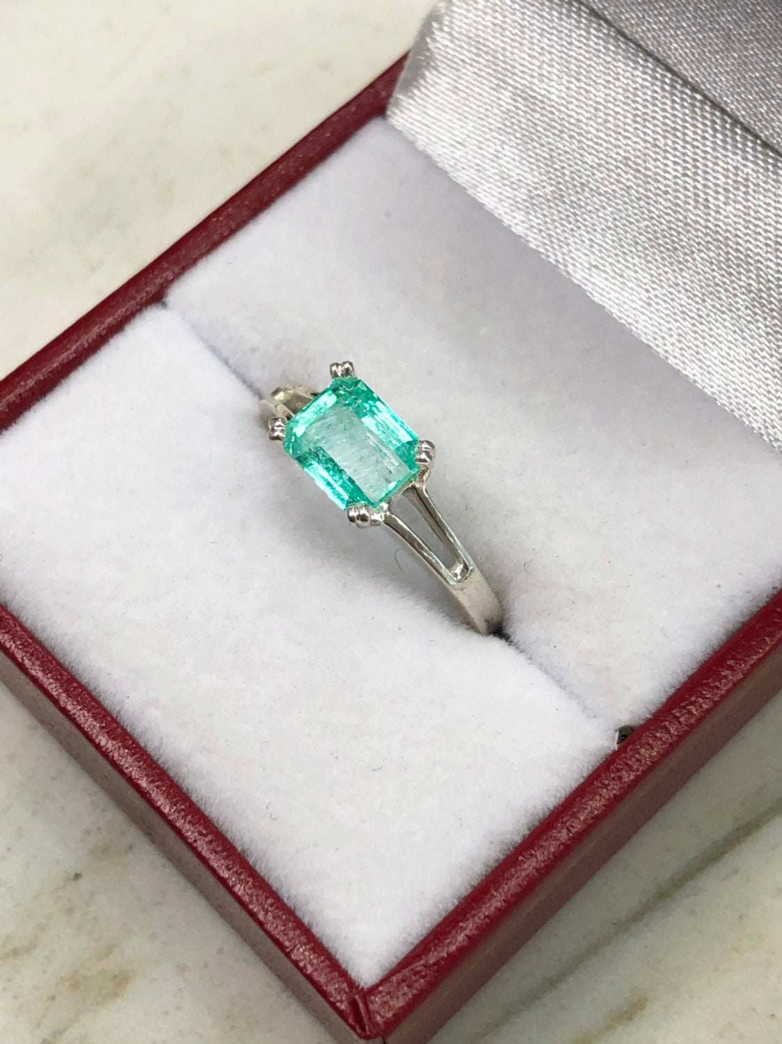 1.25 Carat Emerald Cut Emerald East To West Four Prong Double Shank Ri