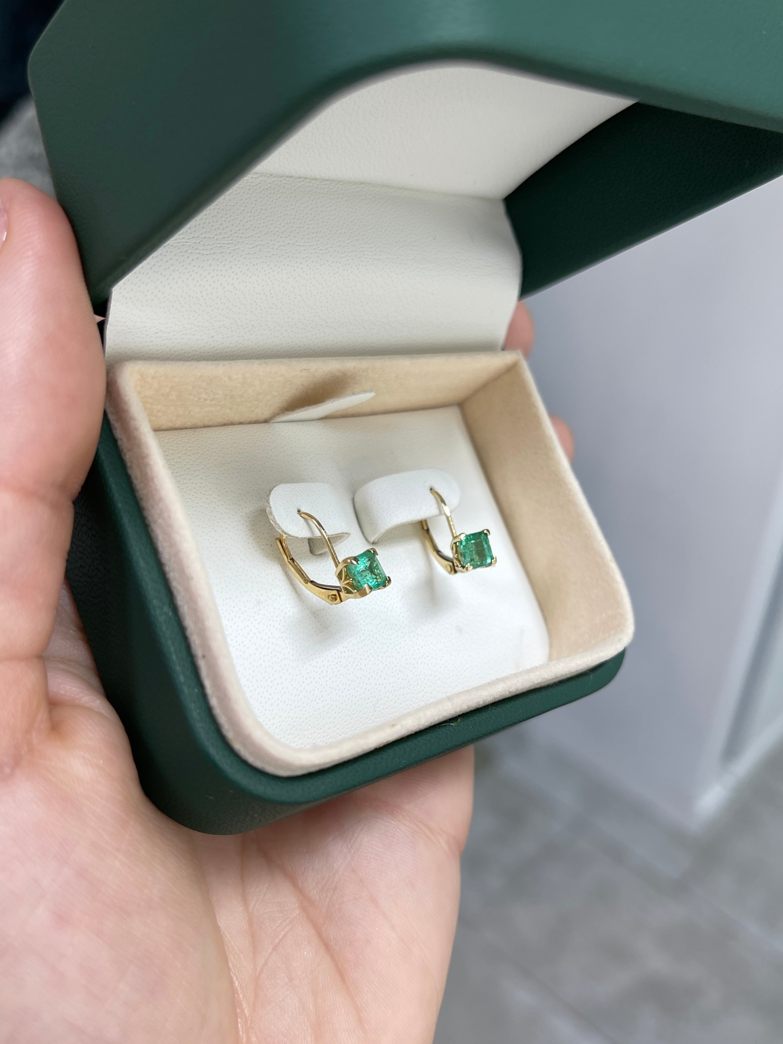 Square emerald leverback earrings with fleur de lis design, 14K gold, featuring 1.44 carats of emeralds from JR Colombian Emeralds.