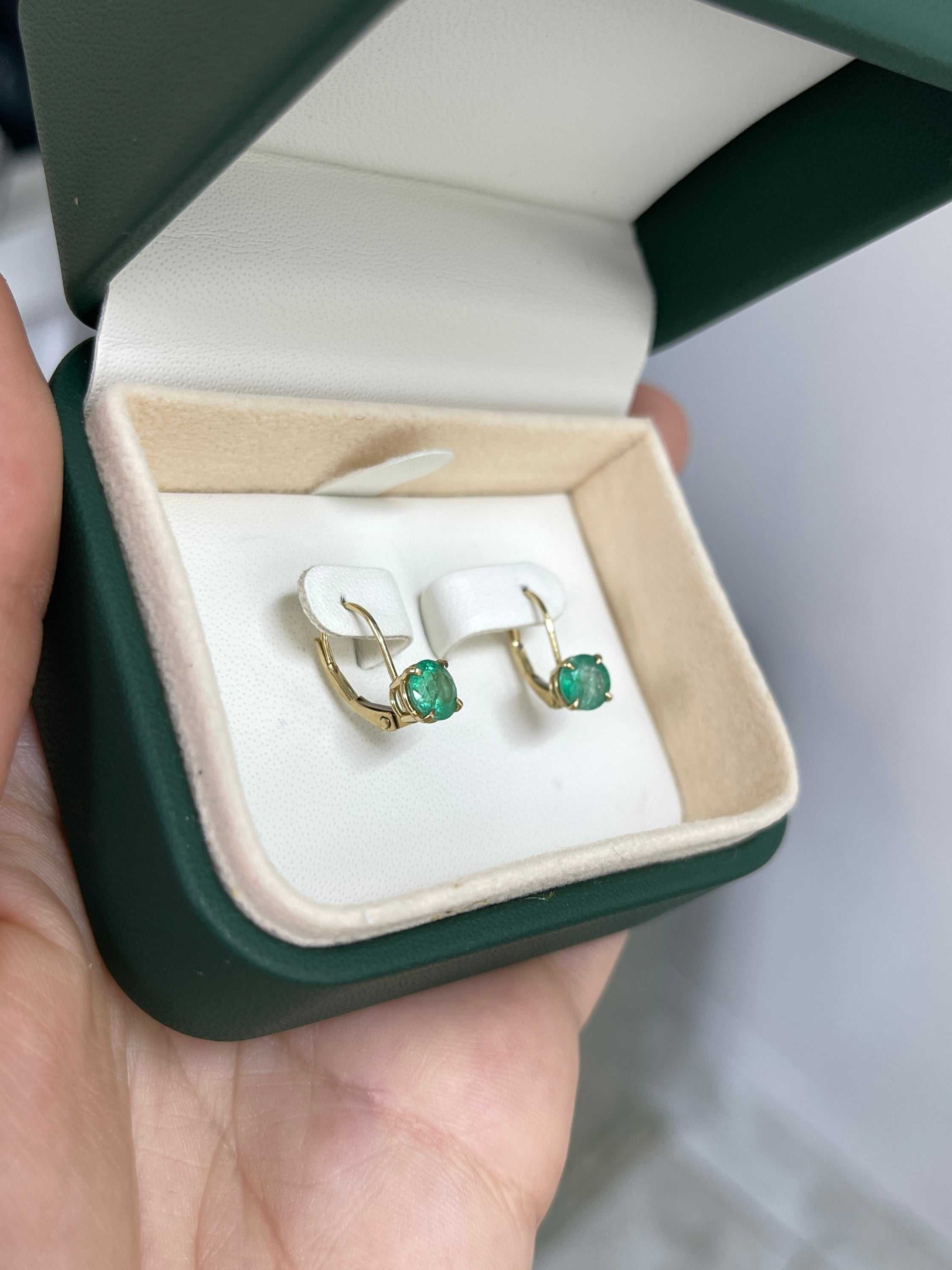 14K yellow gold emerald lever back earrings with 1.50tcw round Colombian emeralds, showcasing elegant jewelry design.