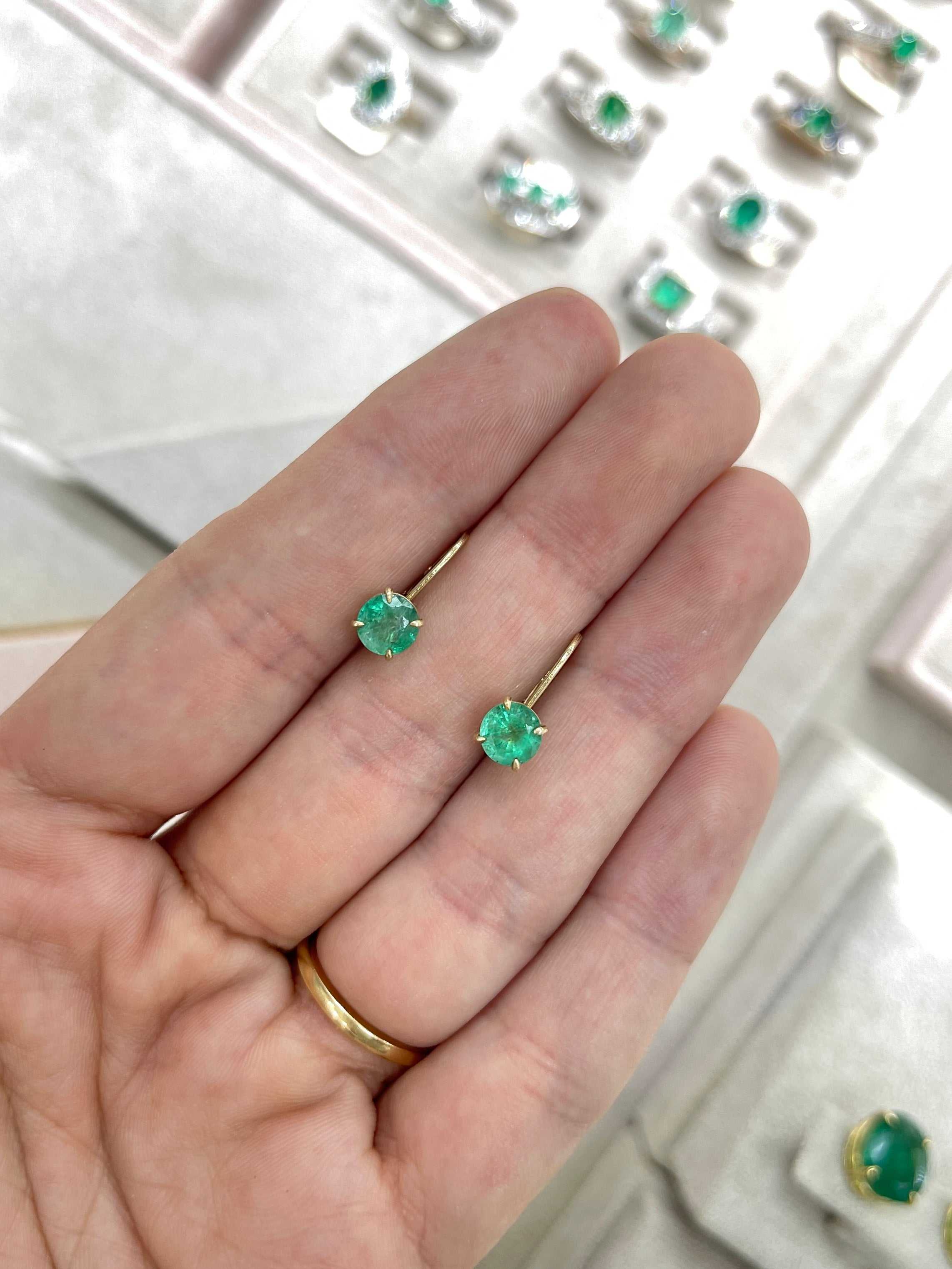 14K yellow gold round emerald lever back earrings with 1.50tcw from JR Colombian Emeralds, featuring vibrant green gemstones.