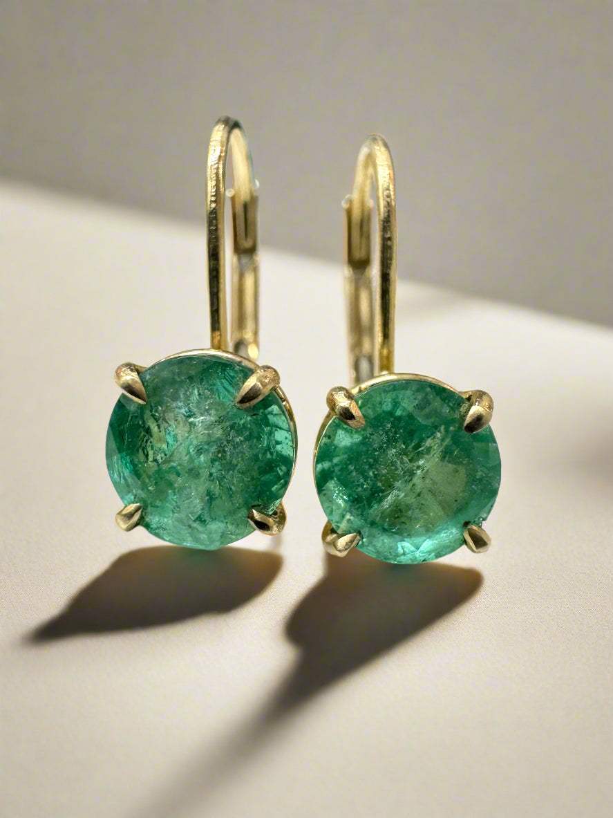 14K yellow gold round emerald lever back earrings with 1.50 TCW from JR Colombian Emeralds, featuring vibrant green gemstones.