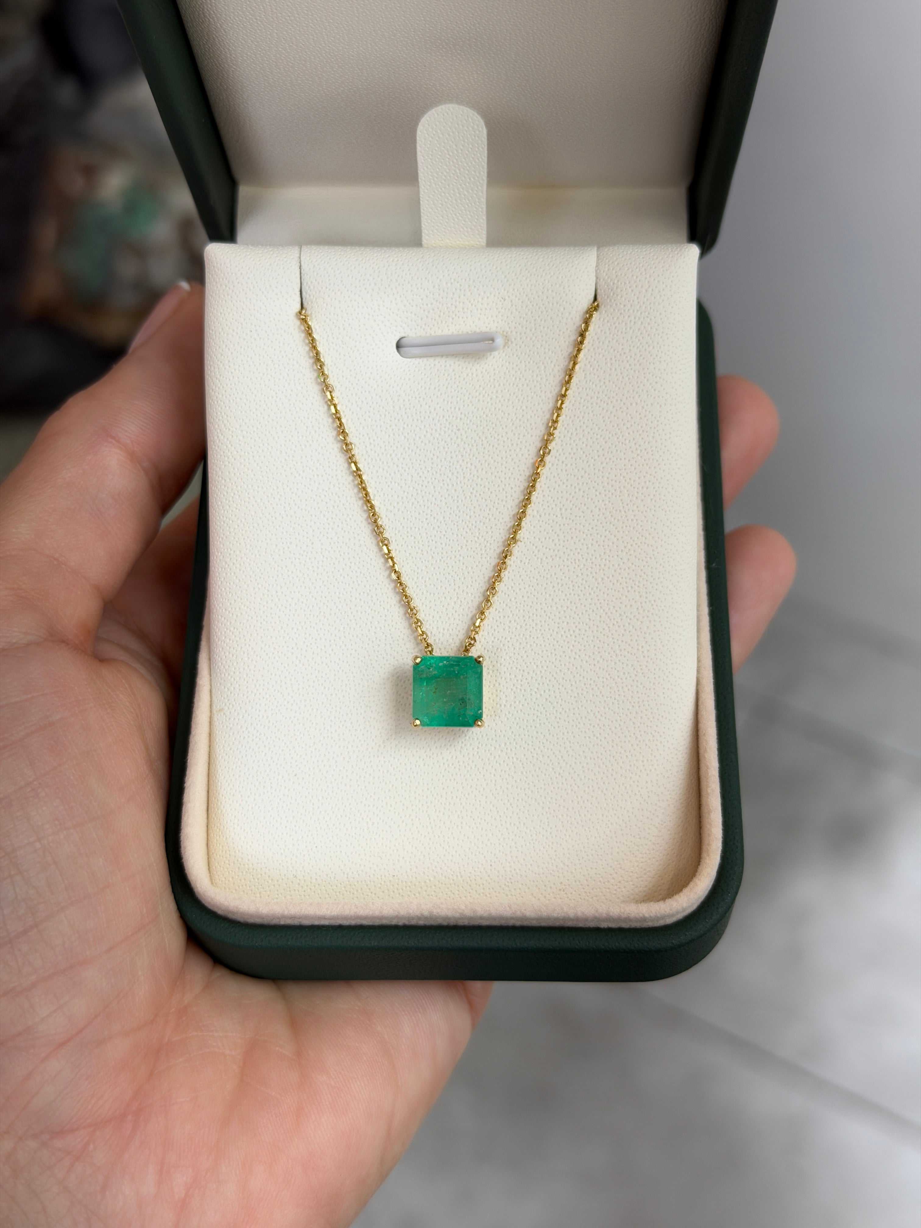 Asscher cut Colombian emerald sliding necklace with 3.0 carats in 14K gold, featuring a vibrant green gemstone and elegant design.