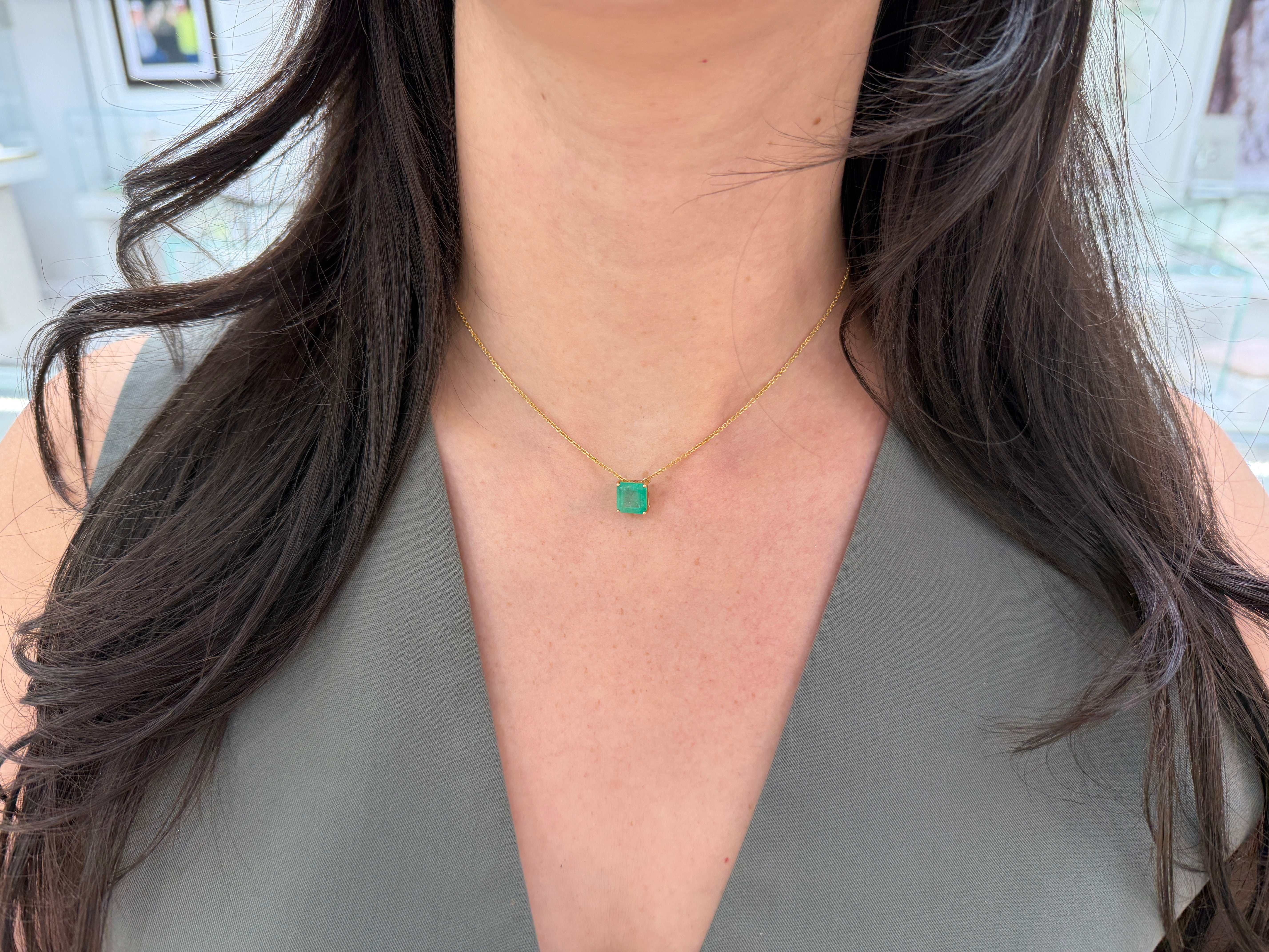 Asscher cut Colombian emerald sliding necklace with 3.0 carats in 14K gold, featuring a sparkling emerald centerpiece.