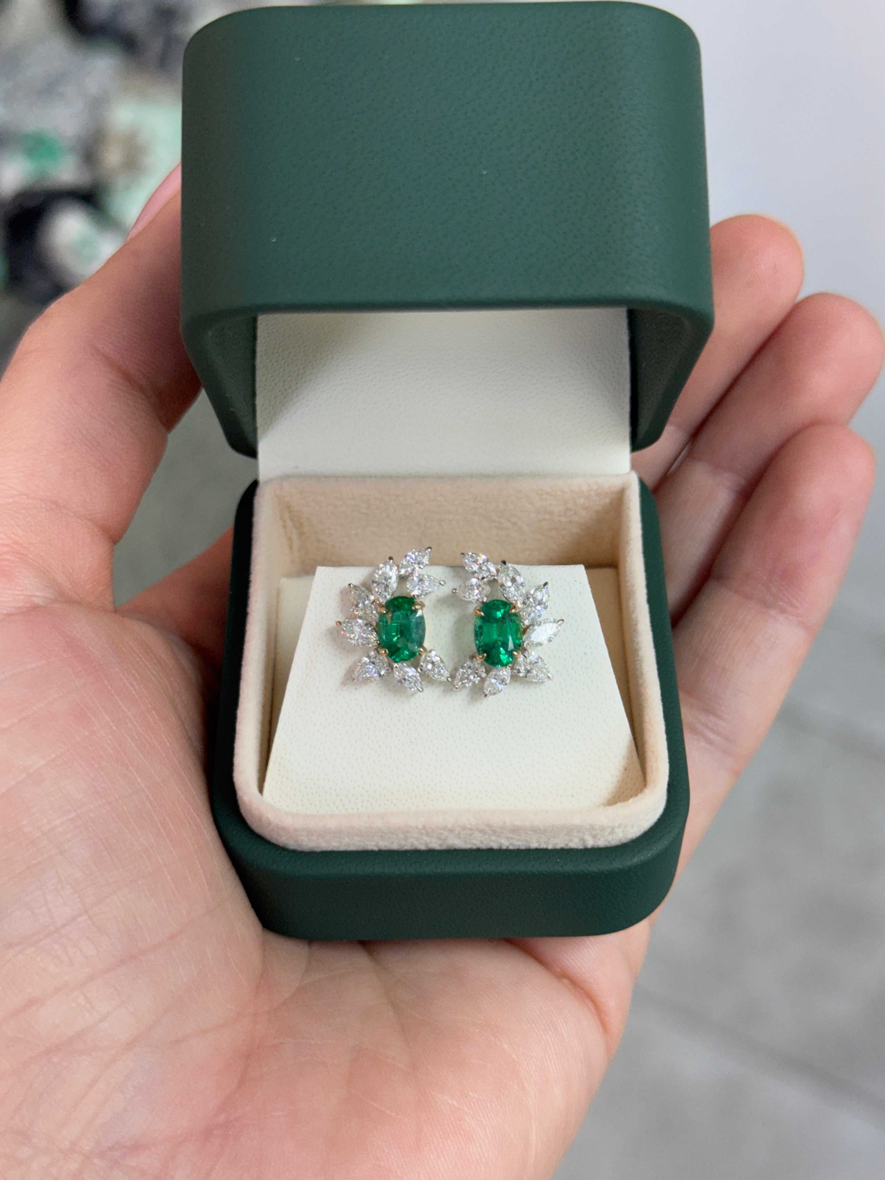 Oval emerald and diamond marquise and pear-shaped statement stud earrings by JR Colombian Emeralds, set in 18K gold.