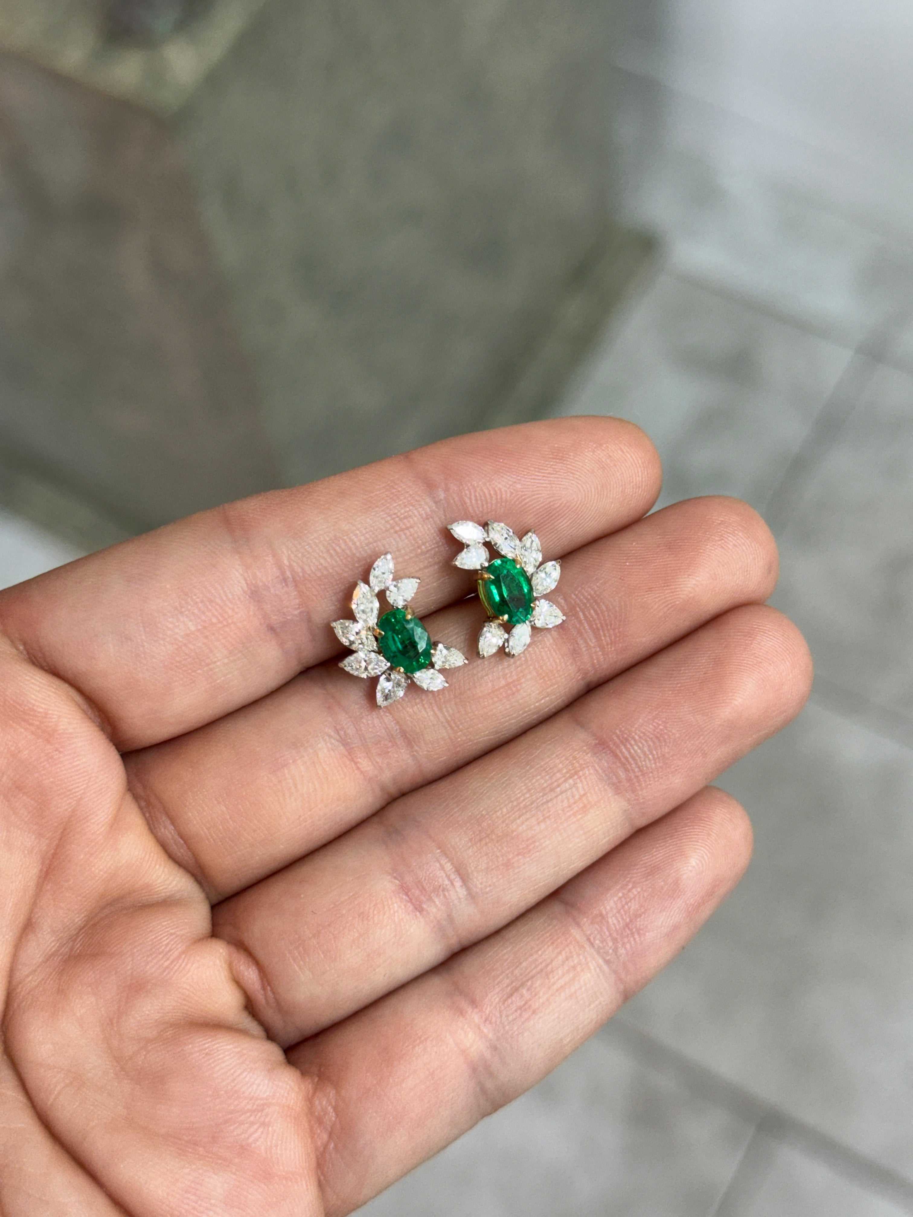 JR Colombian Emeralds 3.69tcw oval emerald and diamond marquise and pear statement stud earrings in 18K gold, featuring vibrant green gemstones.