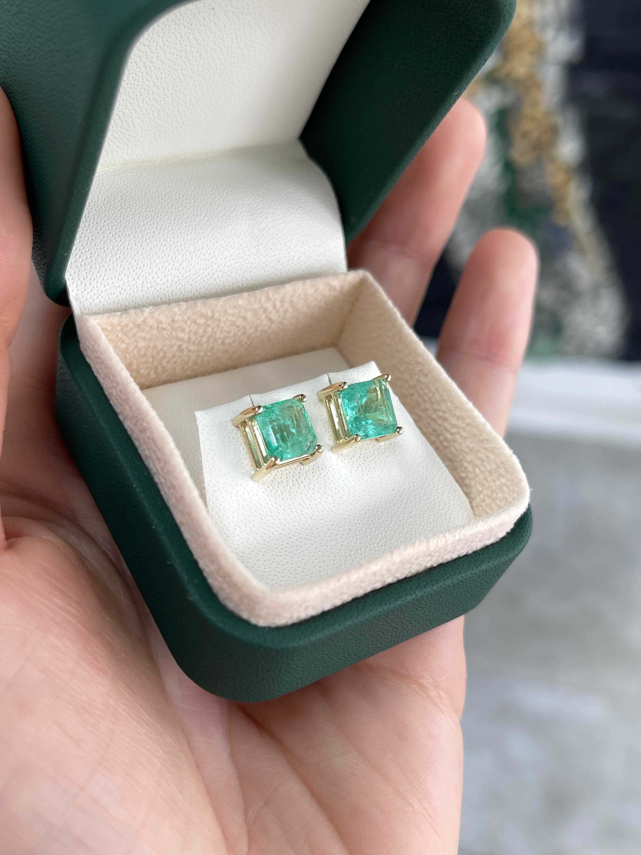 Earthy spring green Colombian emerald stud earrings with asscher cut, 3.97 carats total, set in 14K gold, by JR Colombian Emeralds.