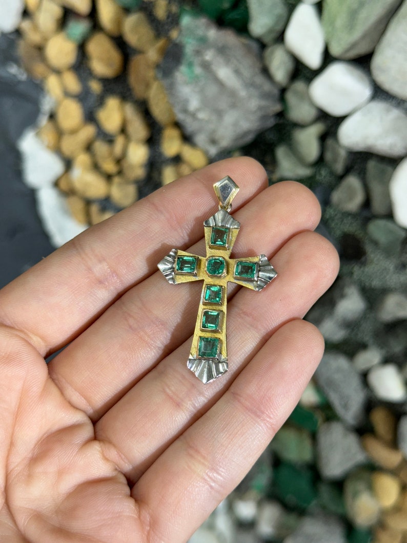 Unisex emerald cross pendant with 2.55tcw Colombian emeralds in 18K two-toned yellow and white gold.