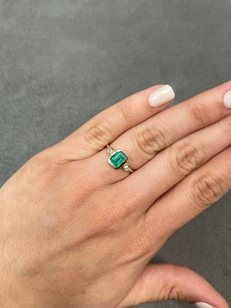 Celebrate Brilliance: 14K Gold Ring Featuring 1.20tcw Bezel Set Three Stone Emerald & Diamond