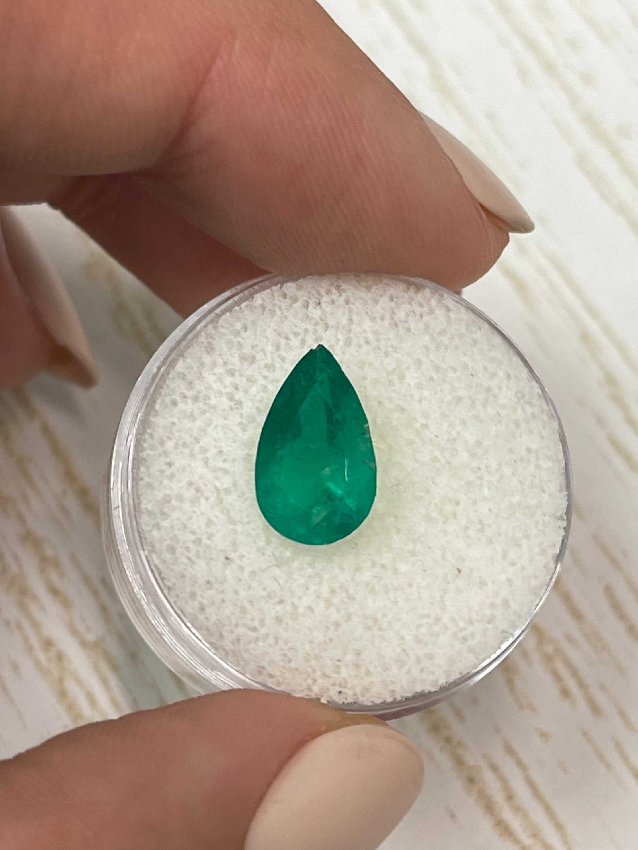 2.34 carat intense green natural Colombian emerald in a pear cut, showcased by JR Colombian Emeralds.