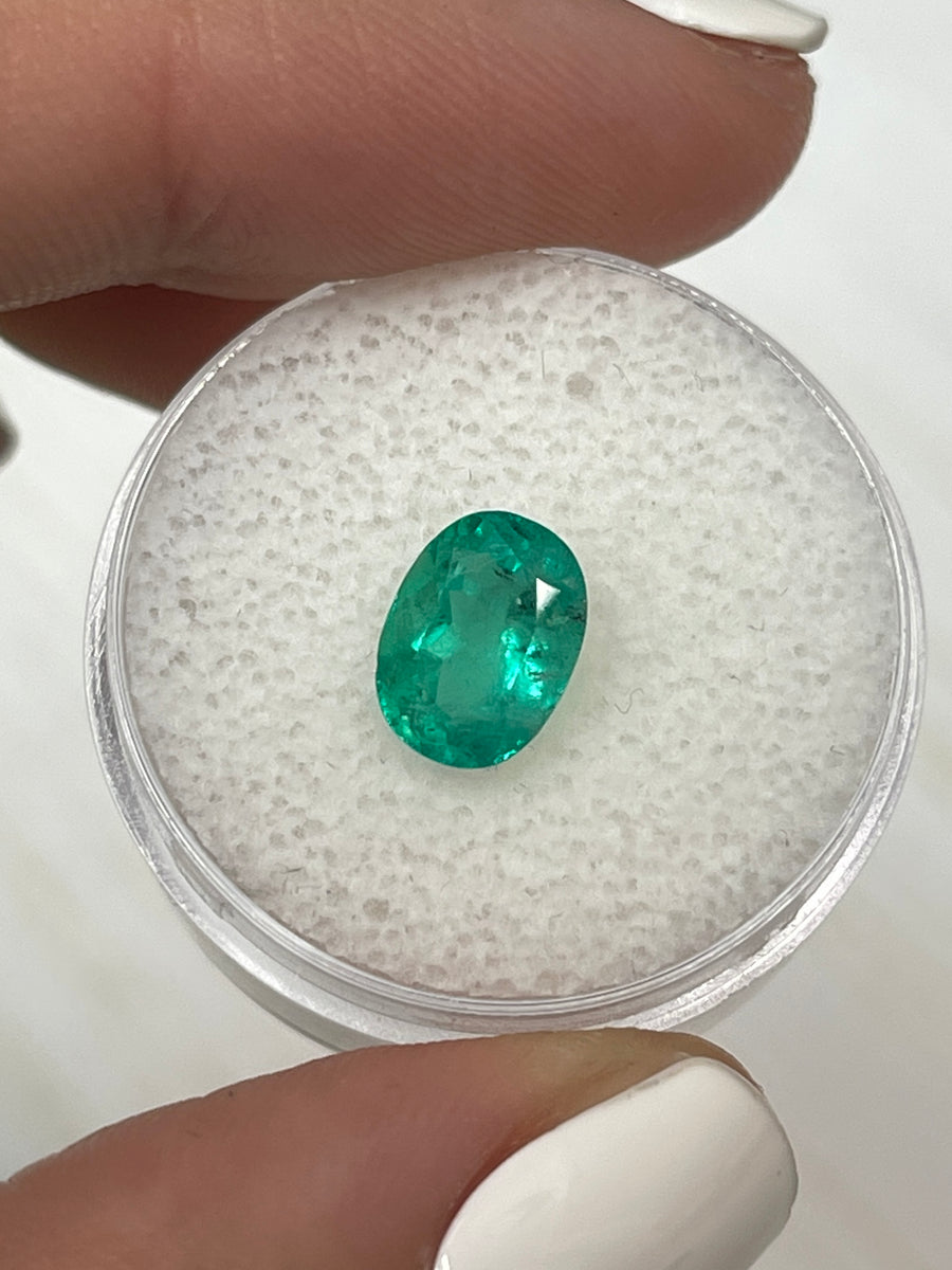 Genuine Colombian Emerald - 1.74 Carat Oval Gem with Natural Bluish Green Speckles